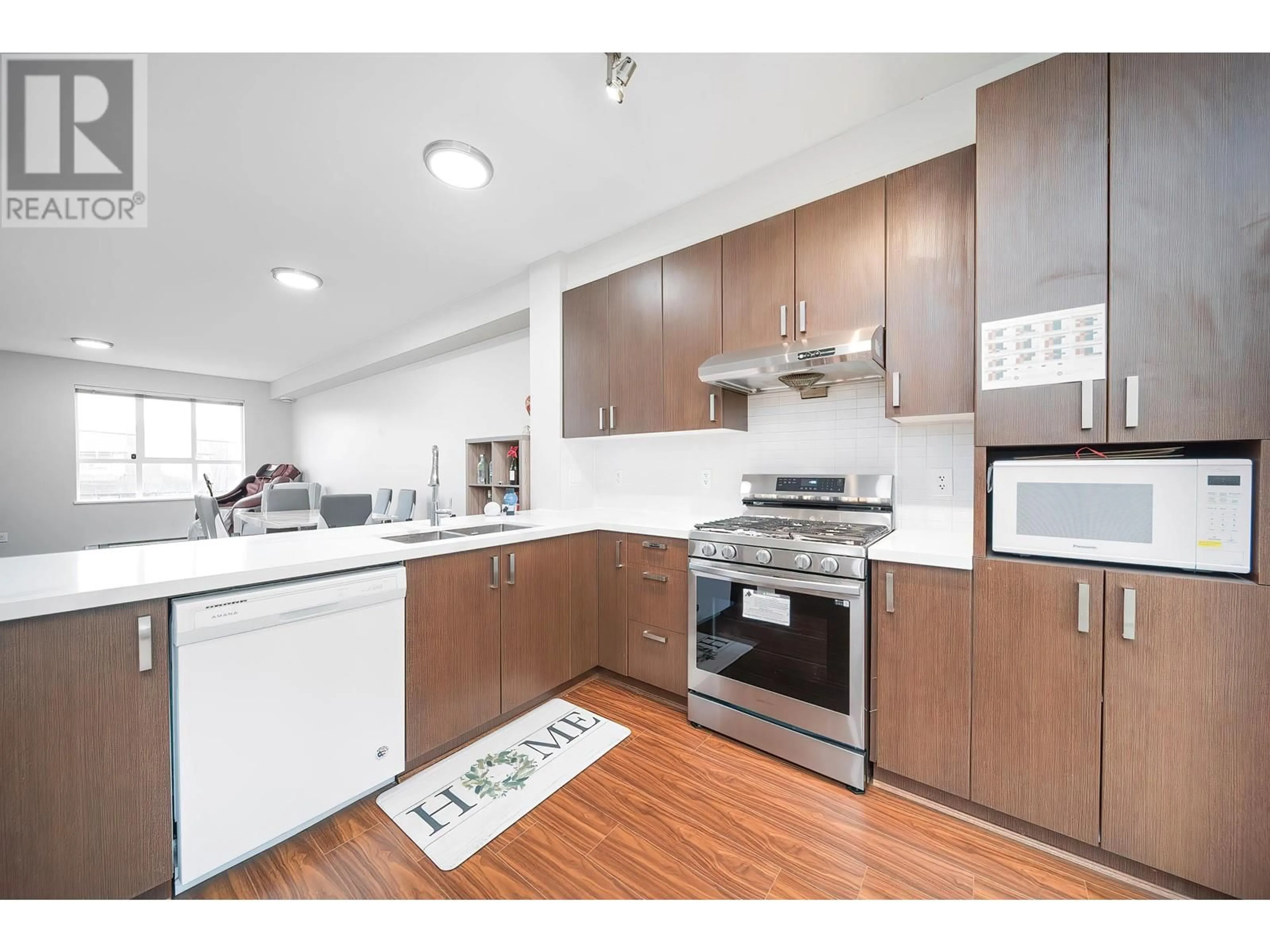 Open concept kitchen, wood/laminate floor for 65 - 9566 TOMICKI AVENUE, Richmond British Columbia V6X0E6