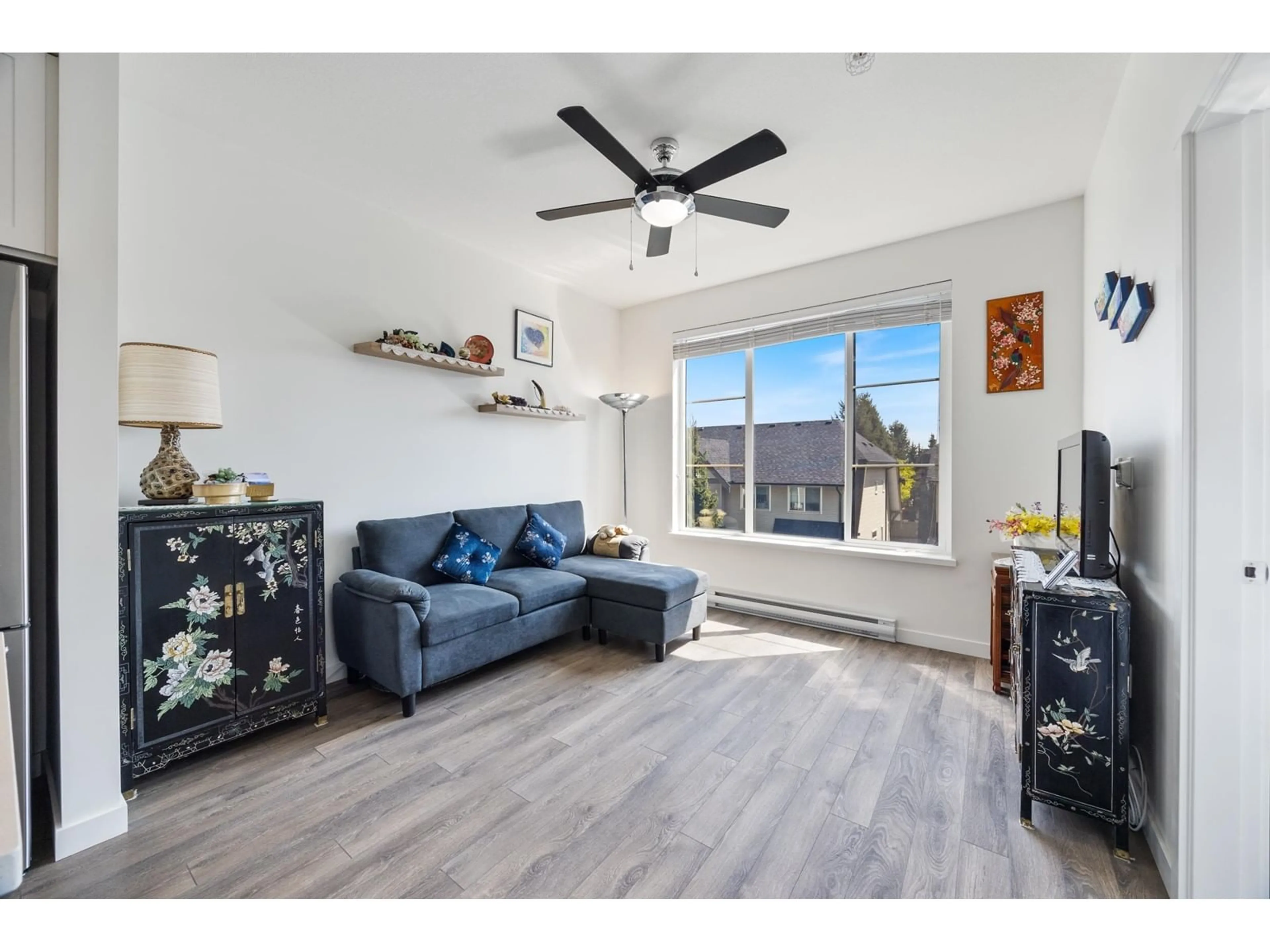 Living room with furniture, wood/laminate floor for 312 - 15835 85, Surrey British Columbia V4N6W6