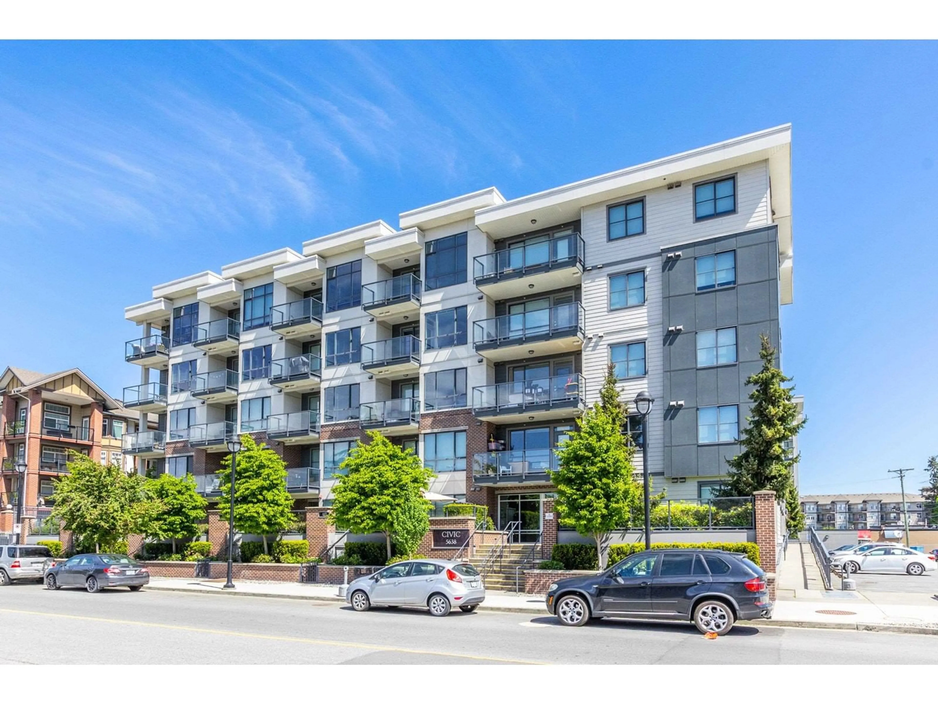 A pic from outside/outdoor area/front of a property/back of a property/a pic from drone, street for 407 - 5638 201A, Langley British Columbia V3A0L8