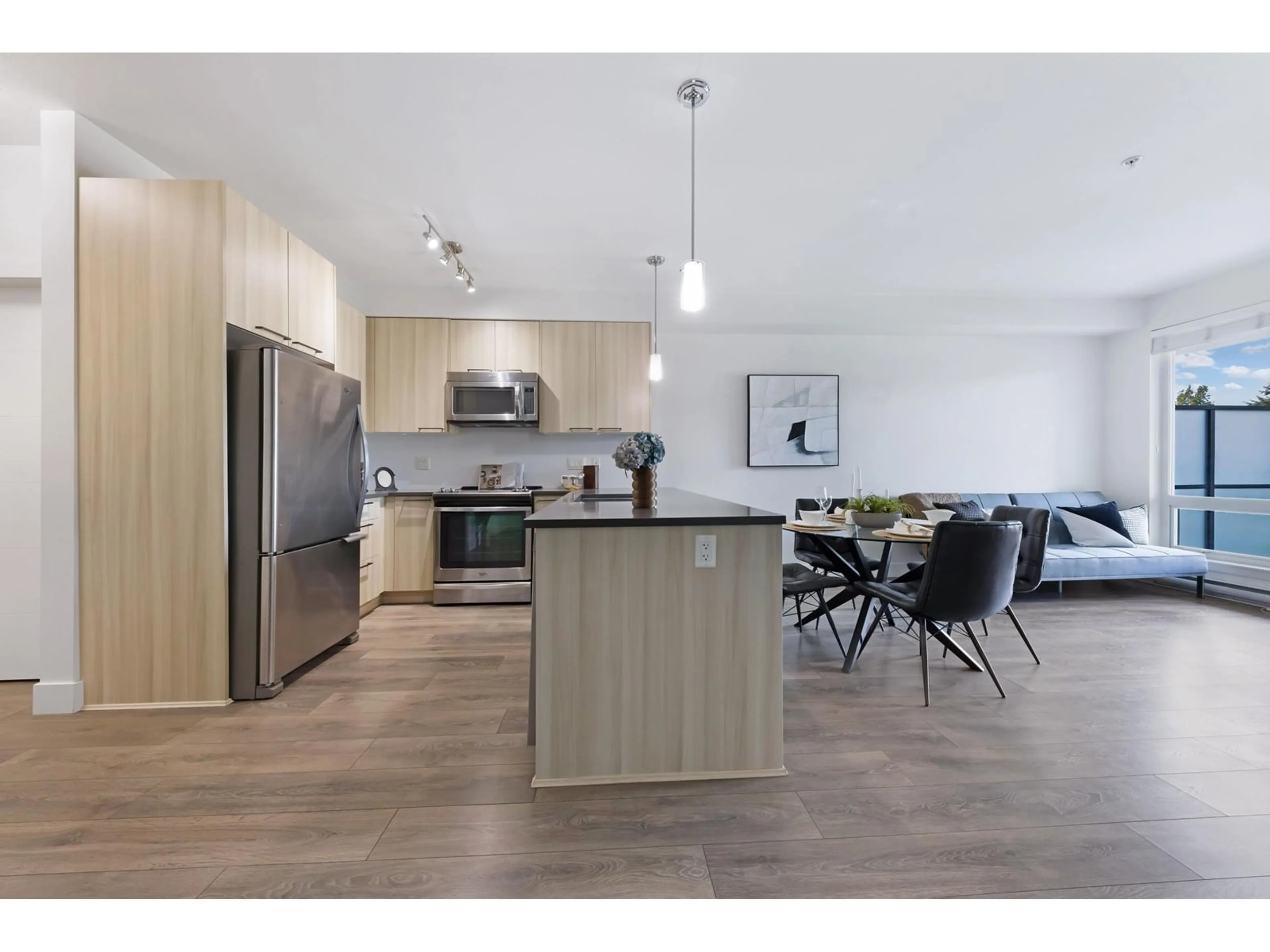 Open concept kitchen, wood/laminate floor for 204 - 15628 104, Surrey British Columbia V4N2J3