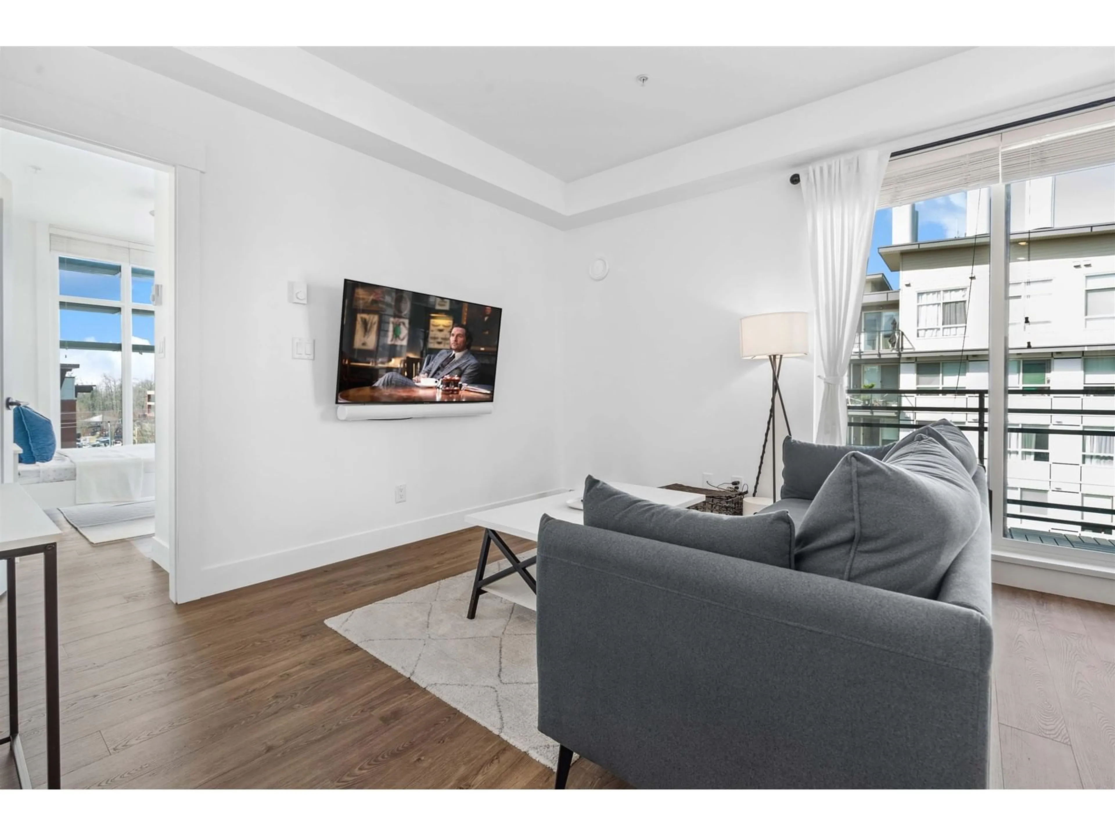 Living room with furniture, wood/laminate floor for A512 - 20838 78B, Langley British Columbia V2Y3M1