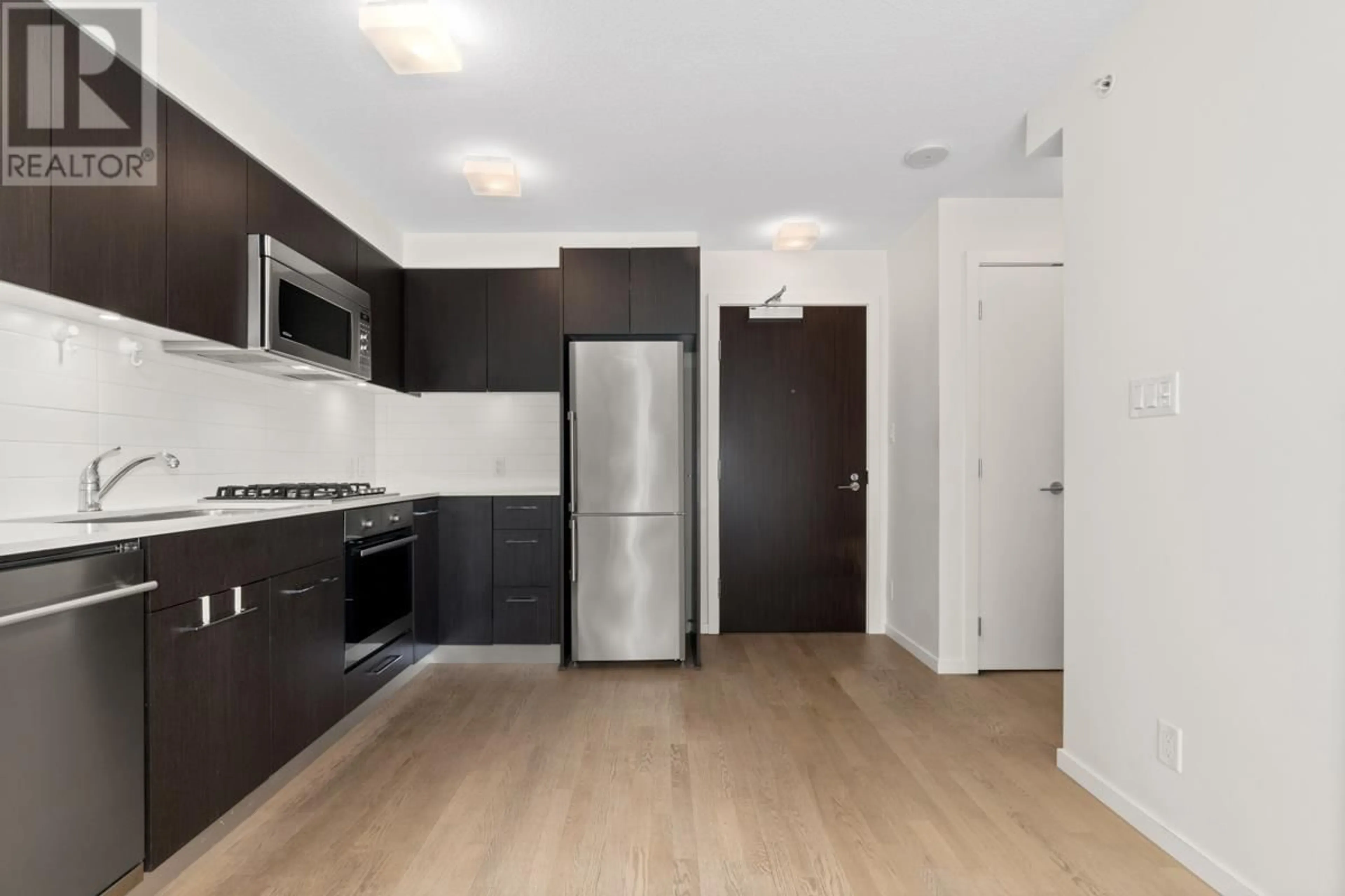 Standard kitchen, wood/laminate floor for 309 - 7733 FIRBRIDGE WAY, Richmond British Columbia V6X0M7