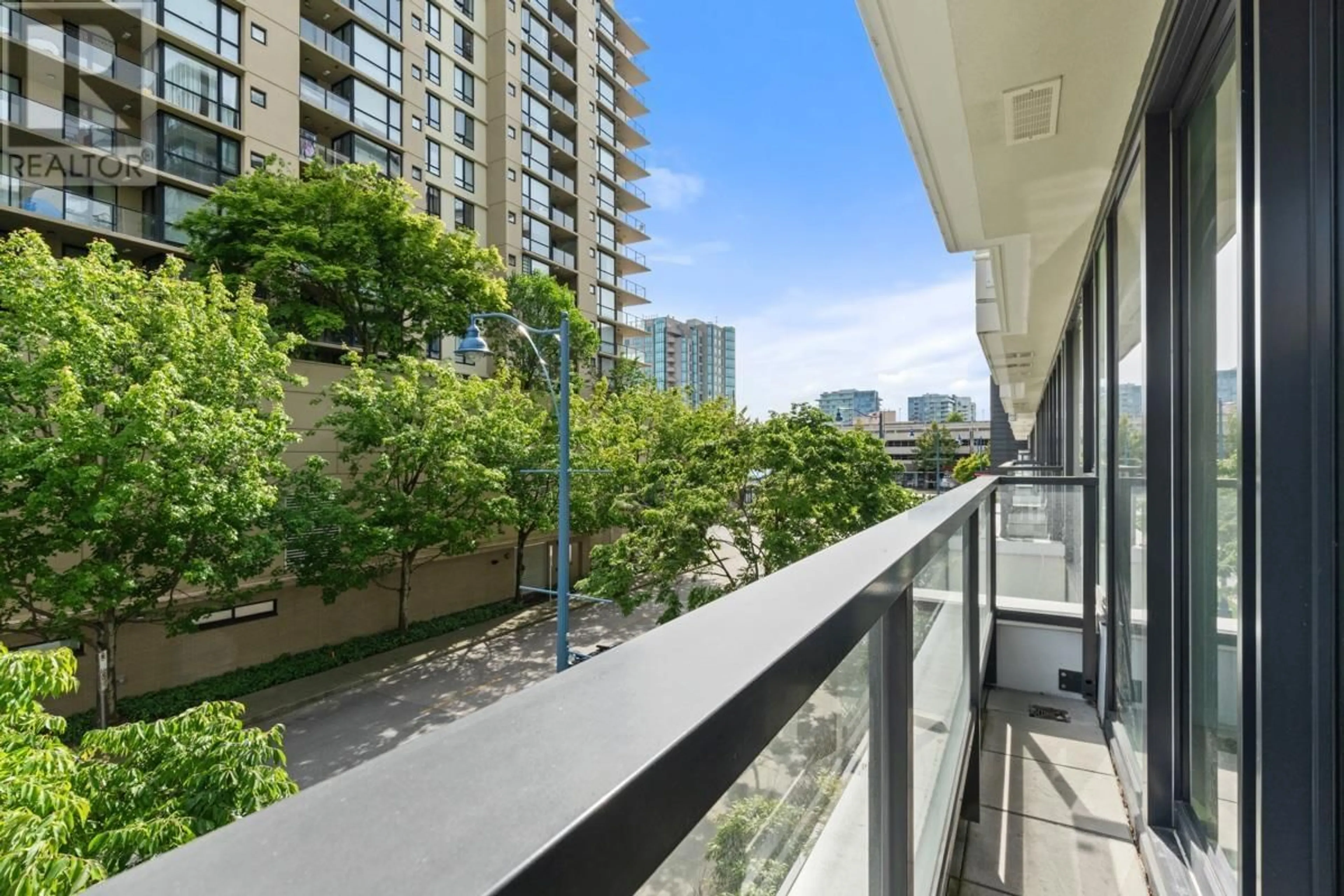 Balcony in the apartment, city buildings view from balcony for 309 - 7733 FIRBRIDGE WAY, Richmond British Columbia V6X0M7