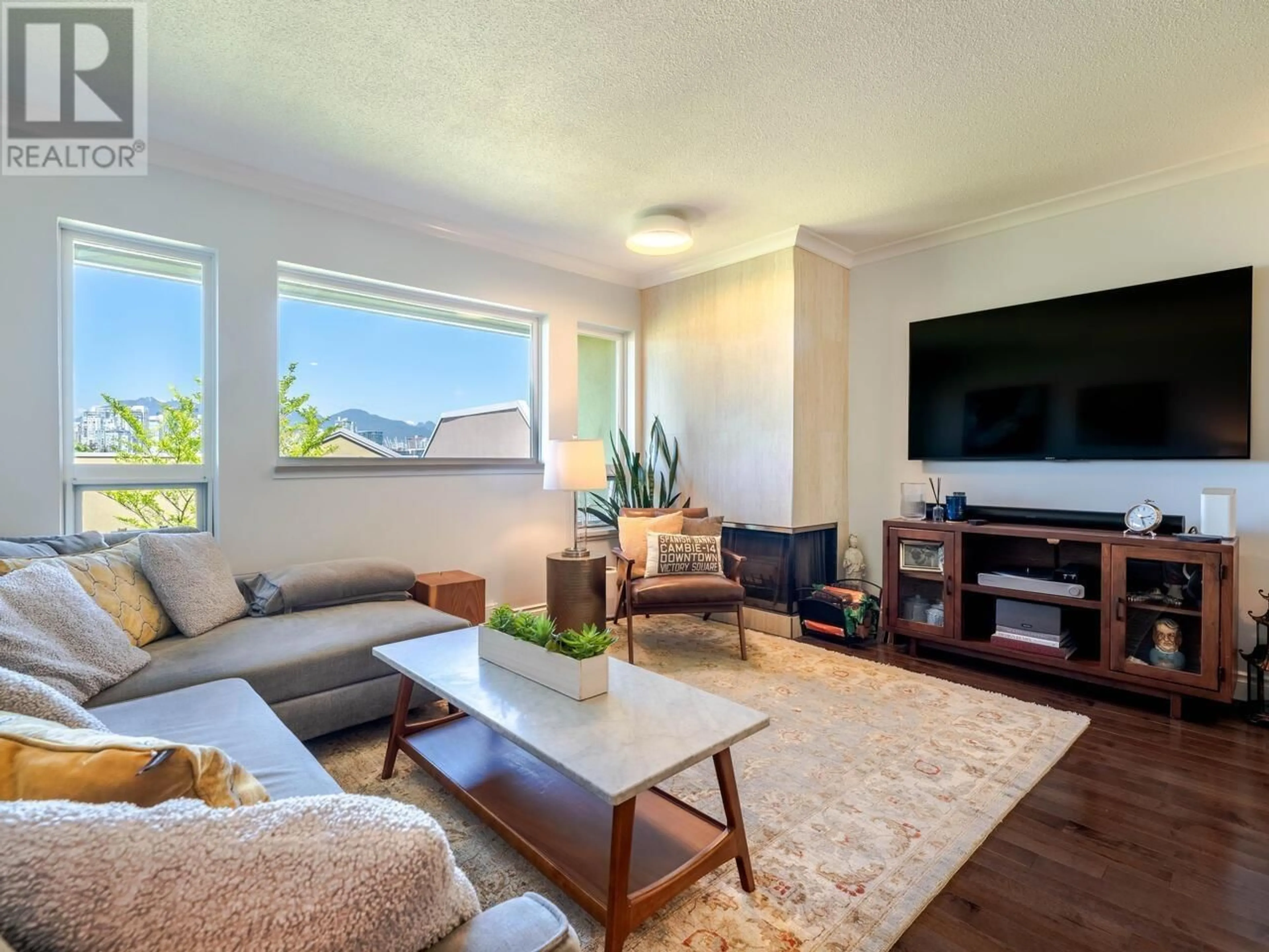 Living room with furniture, wood/laminate floor for 15 - 795 8TH AVENUE, Vancouver British Columbia V5Z1C9