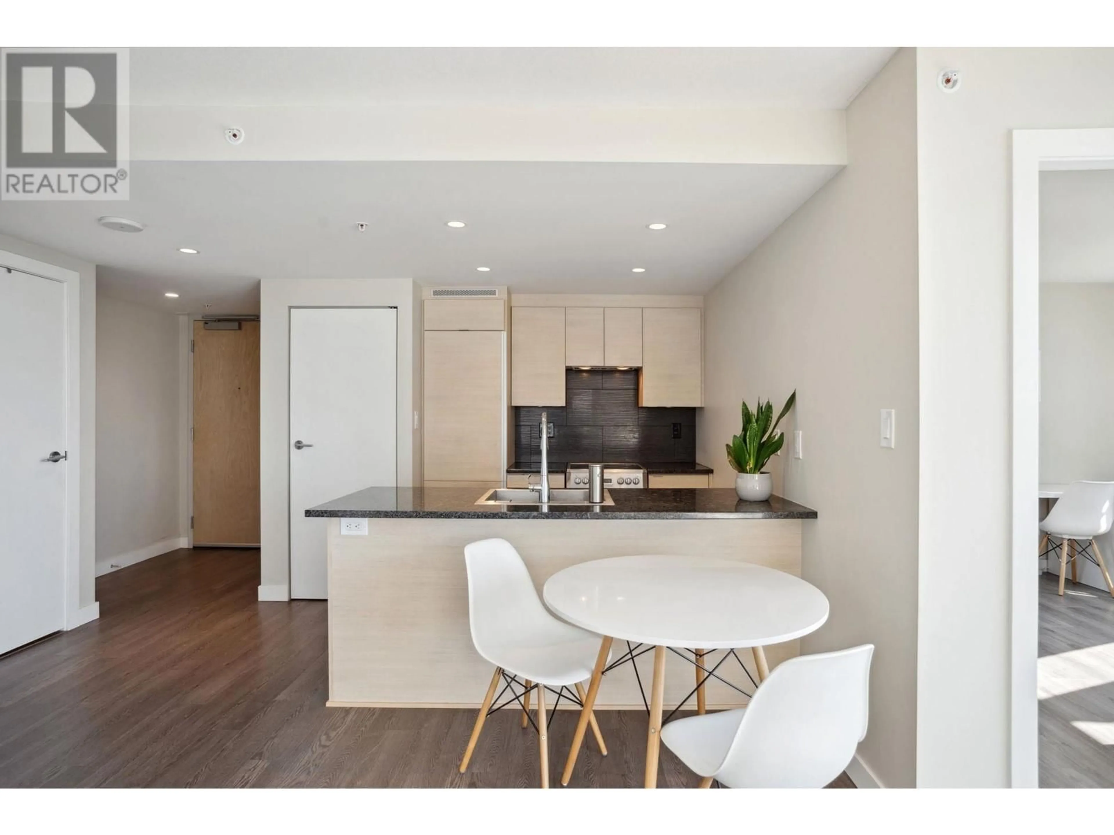 Open concept kitchen, wood/laminate floor for 2106 - 489 INTERURBAN WAY, Vancouver British Columbia V5X0C7