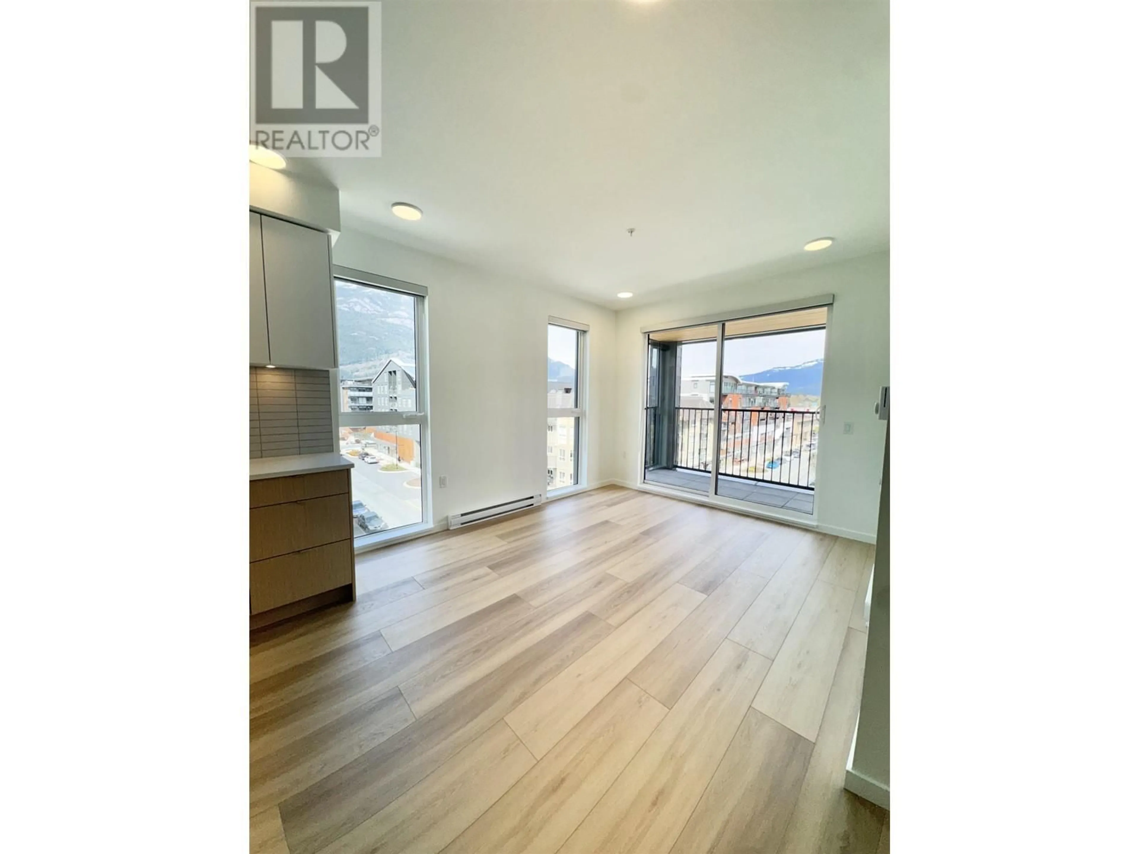 Open concept kitchen, wood/laminate floor for 501 - 37994 SECOND AVENUE, Squamish British Columbia V8B0C3