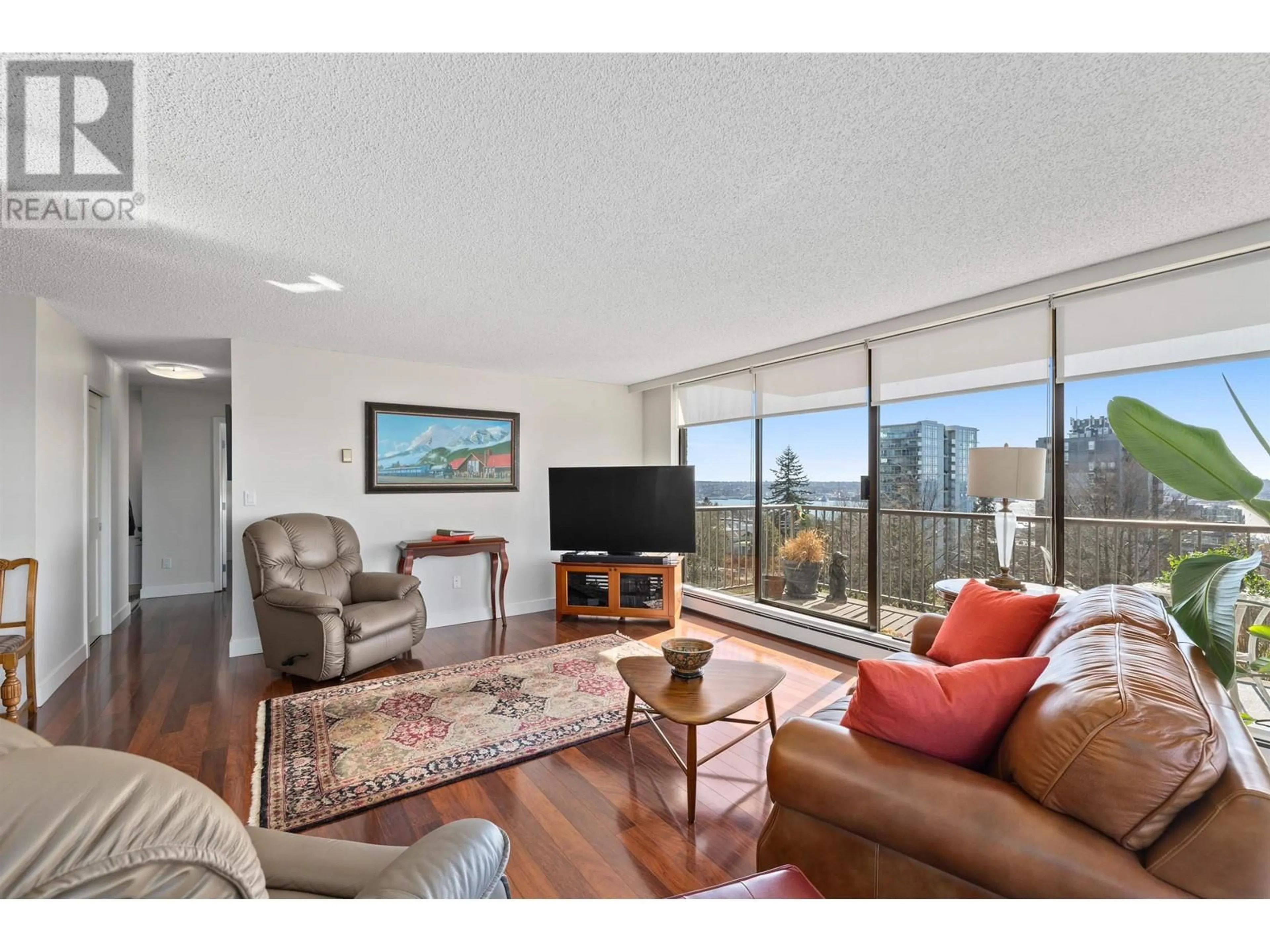 Living room with furniture, wood/laminate floor for 601 - 140 KEITH ROAD, North Vancouver British Columbia V7L4M9