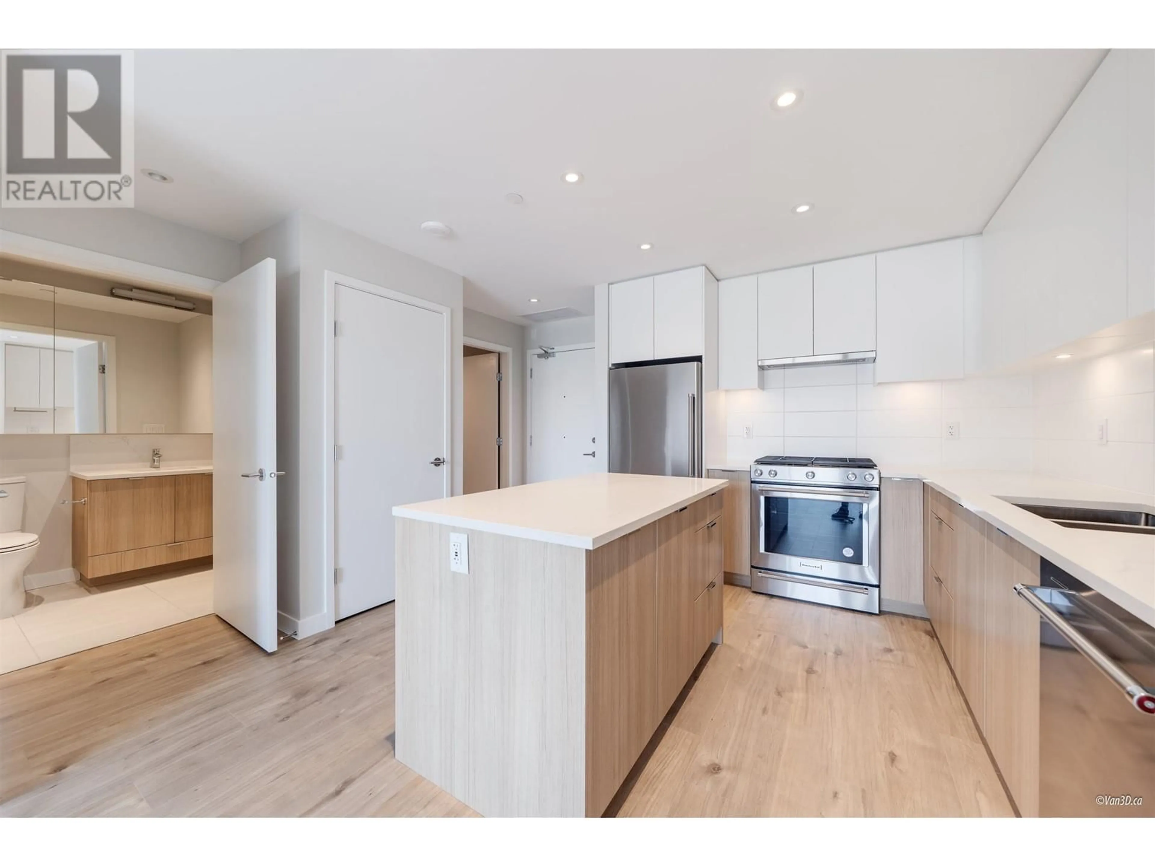 Open concept kitchen, wood/laminate floor for 410 - 3430 KENT AVENUE SOUTH, Vancouver British Columbia V5S0G7