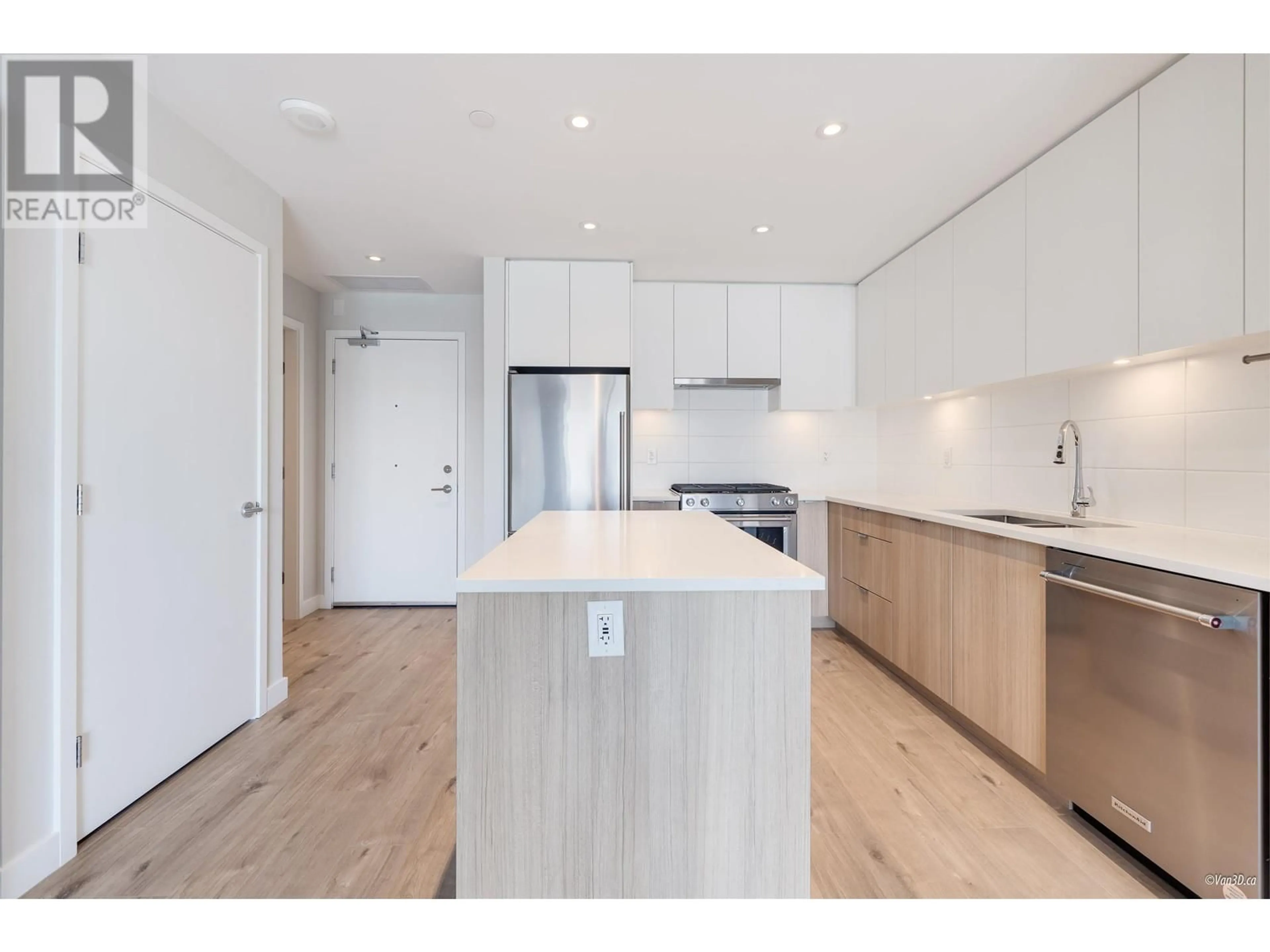 Open concept kitchen, wood/laminate floor for 410 - 3430 KENT AVENUE SOUTH, Vancouver British Columbia V5S0G7