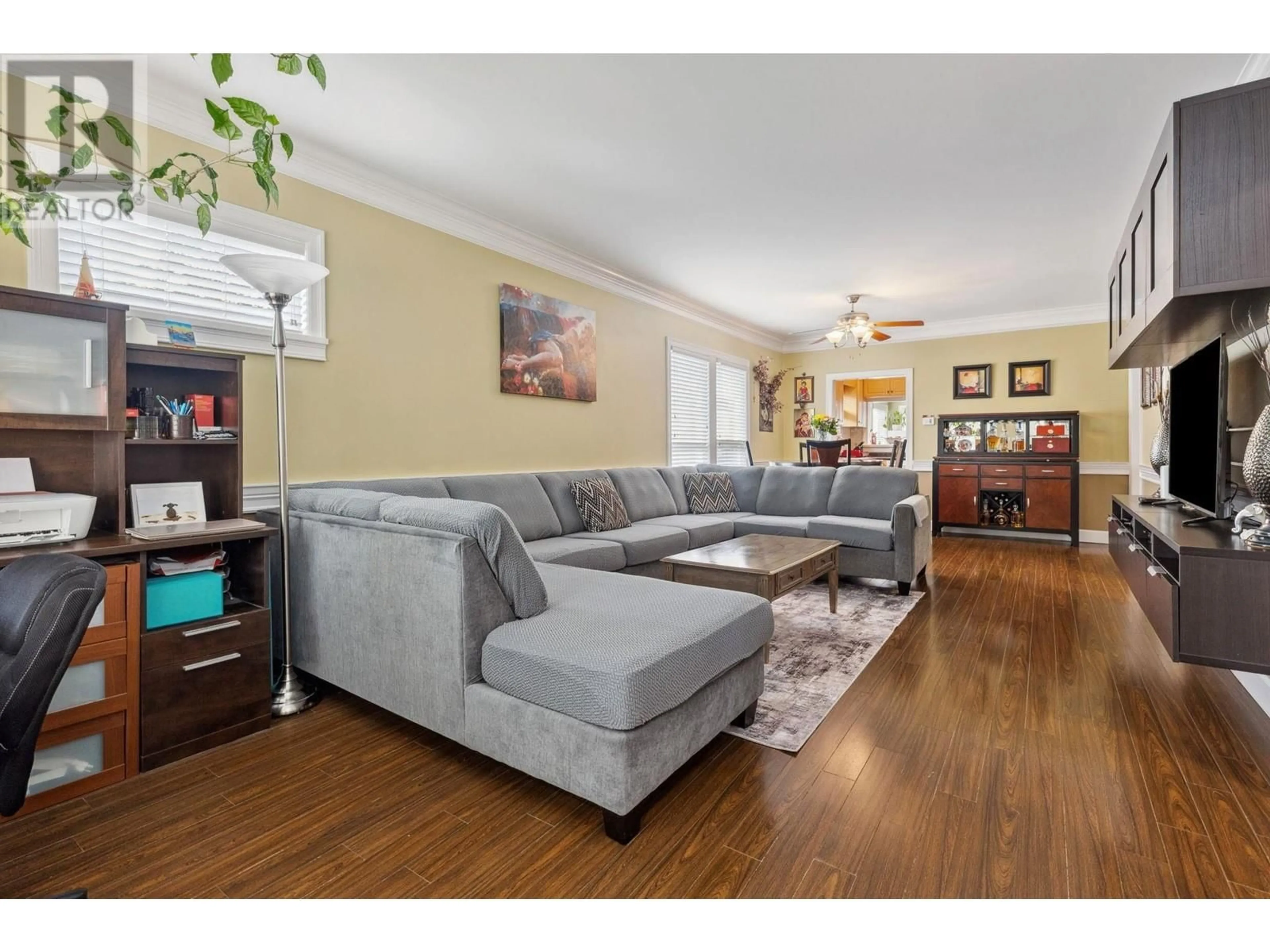 Living room with furniture, wood/laminate floor for 7445 19TH AVENUE, Burnaby British Columbia V3N1E2