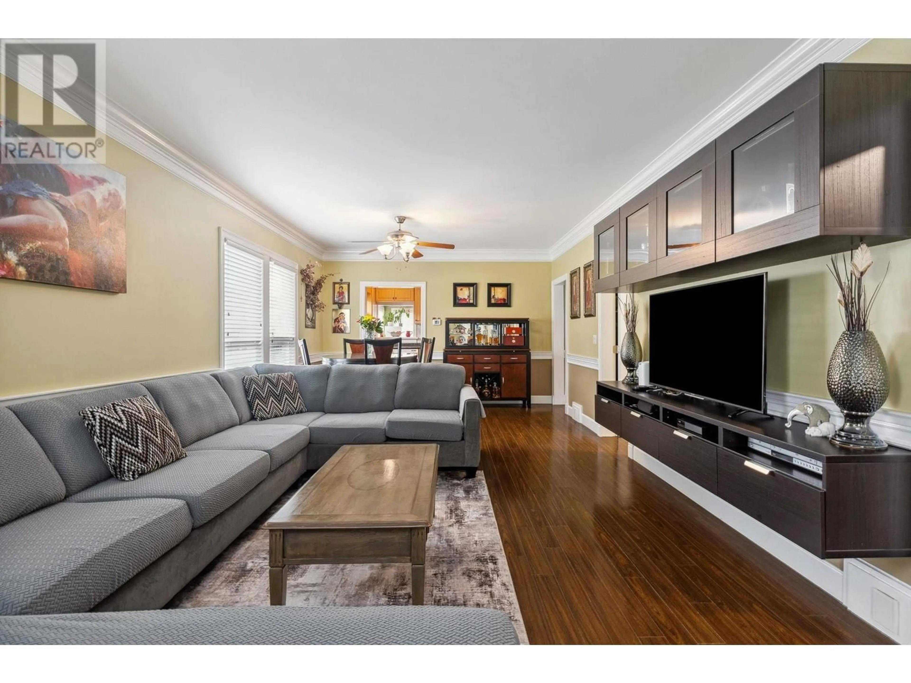 Living room with furniture, wood/laminate floor for 7445 19TH AVENUE, Burnaby British Columbia V3N1E2