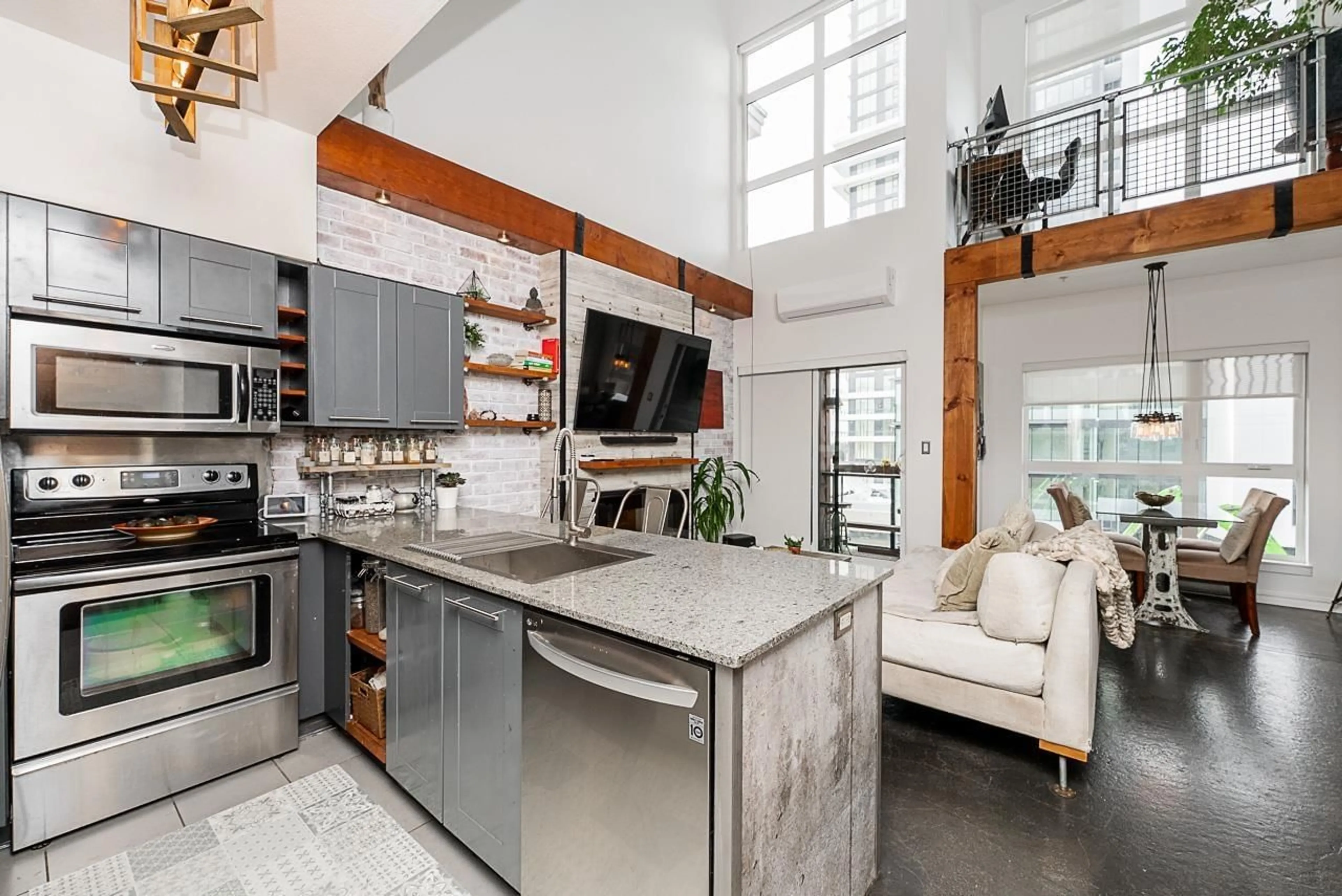 Open concept kitchen, cement floor for 407 - 13733 107A, Surrey British Columbia V3T0B7