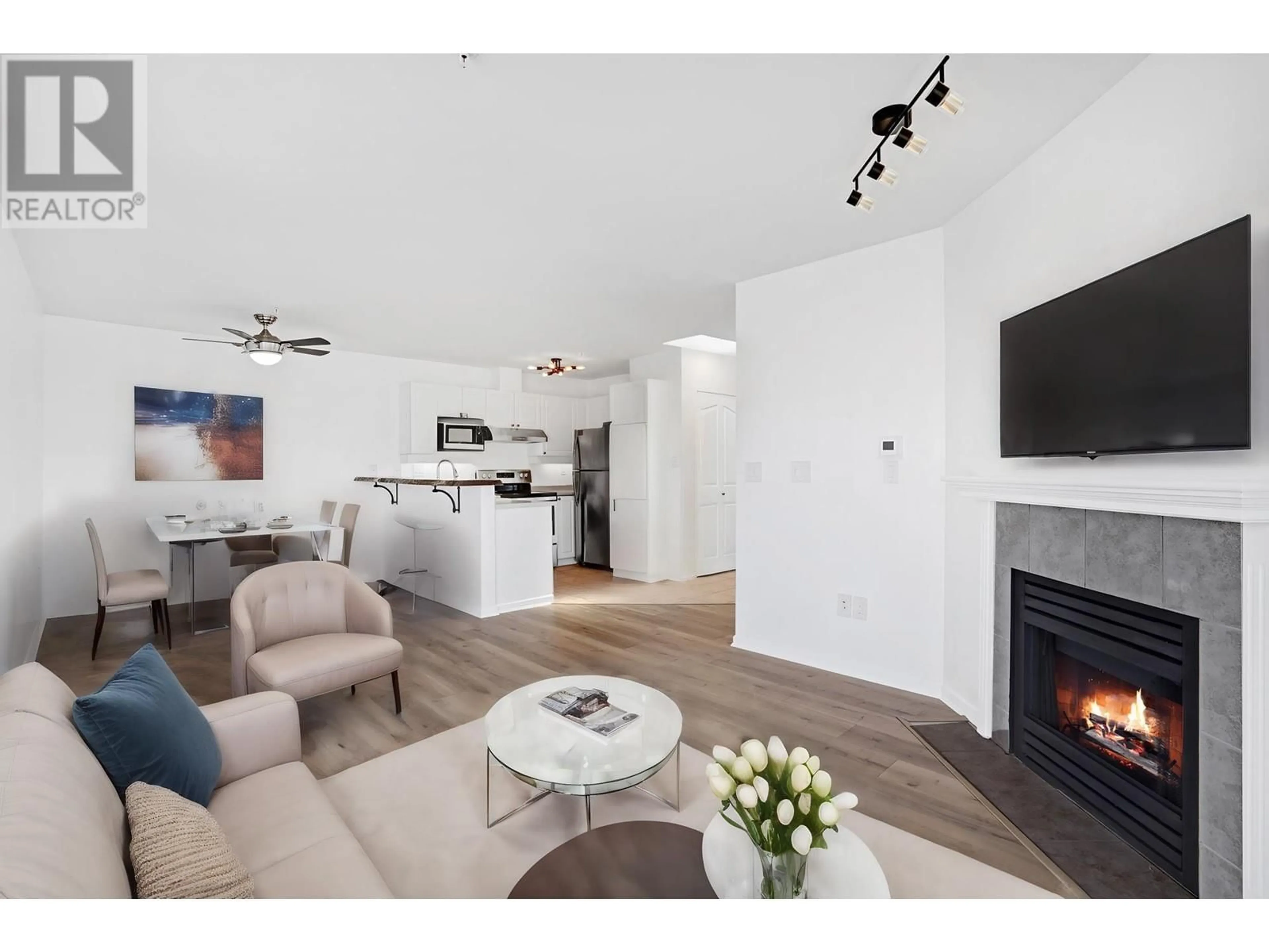 Living room with furniture, wood/laminate floor for 402 - 1618 GRANT AVENUE, Port Coquitlam British Columbia V3B1P3
