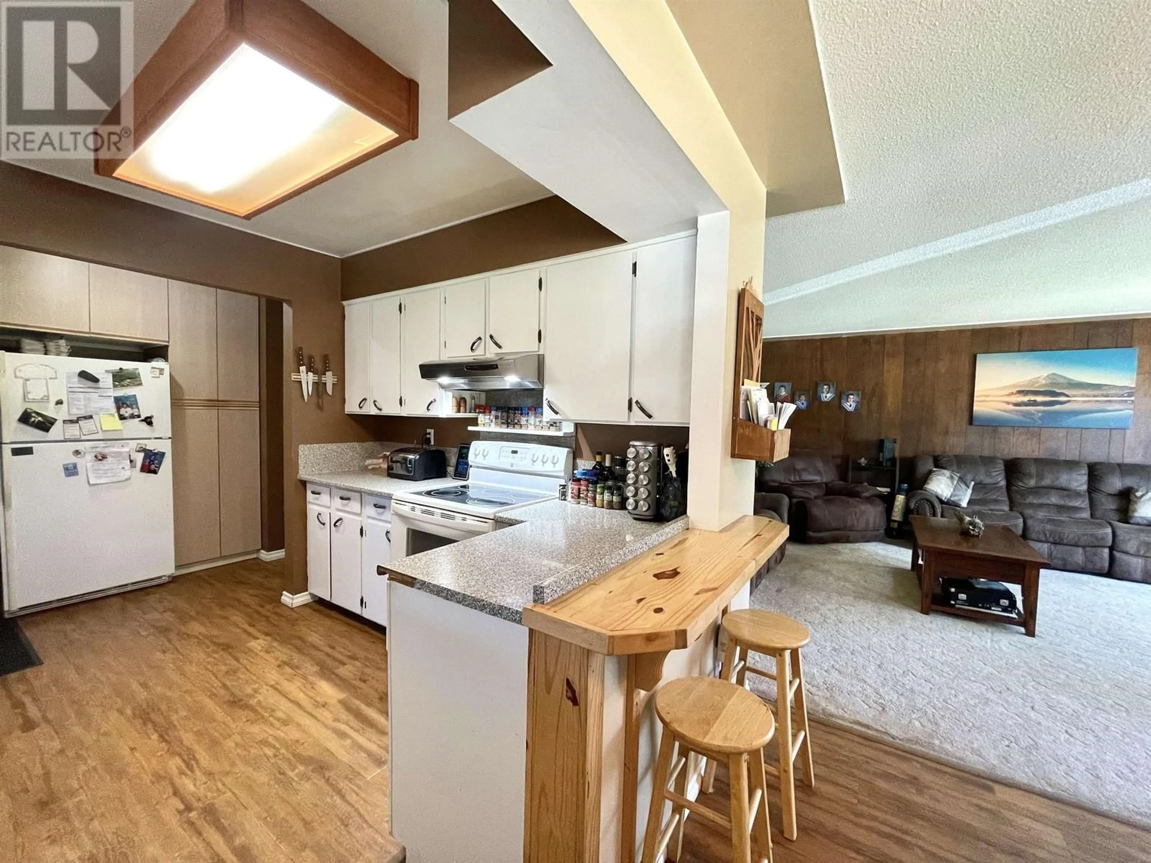 Open concept kitchen, wood/laminate floor for 3731 12TH AVENUE, Smithers British Columbia V0J2N0