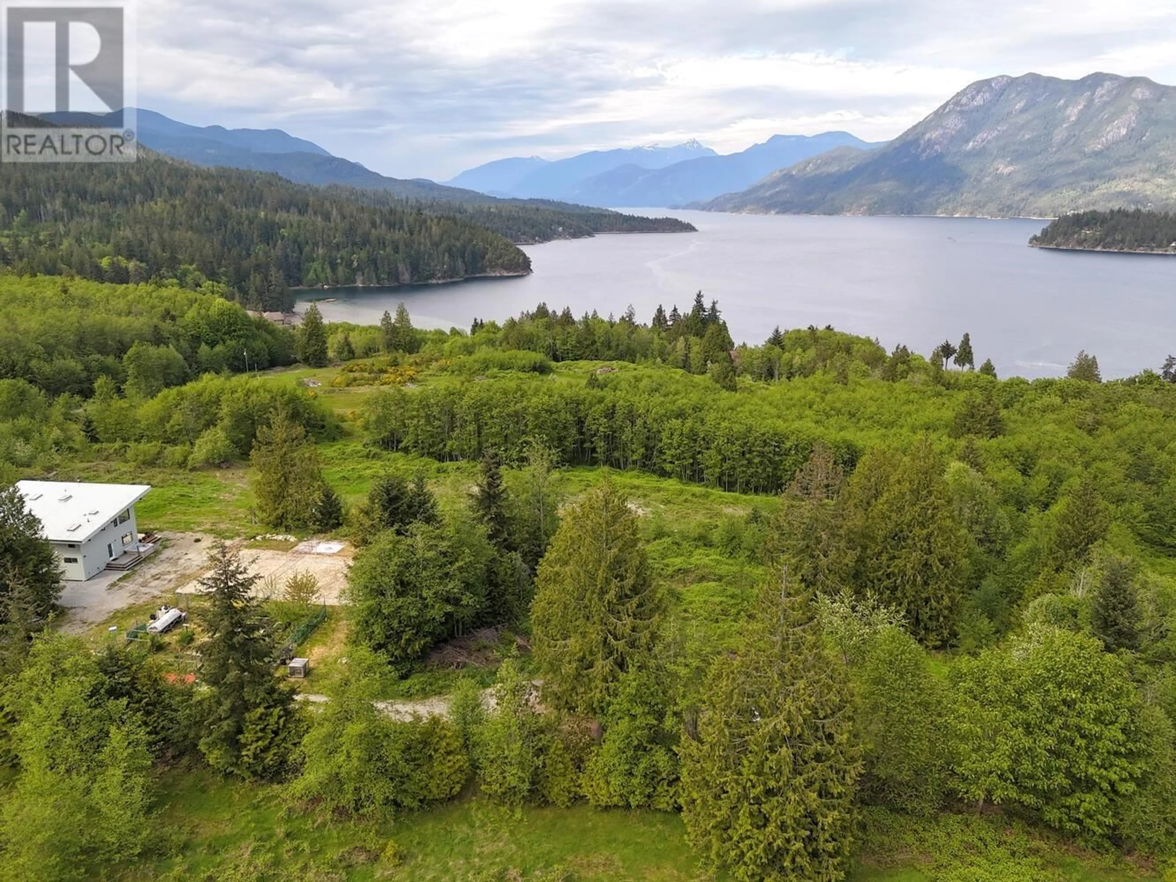 A pic from outside/outdoor area/front of a property/back of a property/a pic from drone, water/lake/river/ocean view for 6400 CROWSTON ROAD, Sechelt British Columbia V7Z0L1