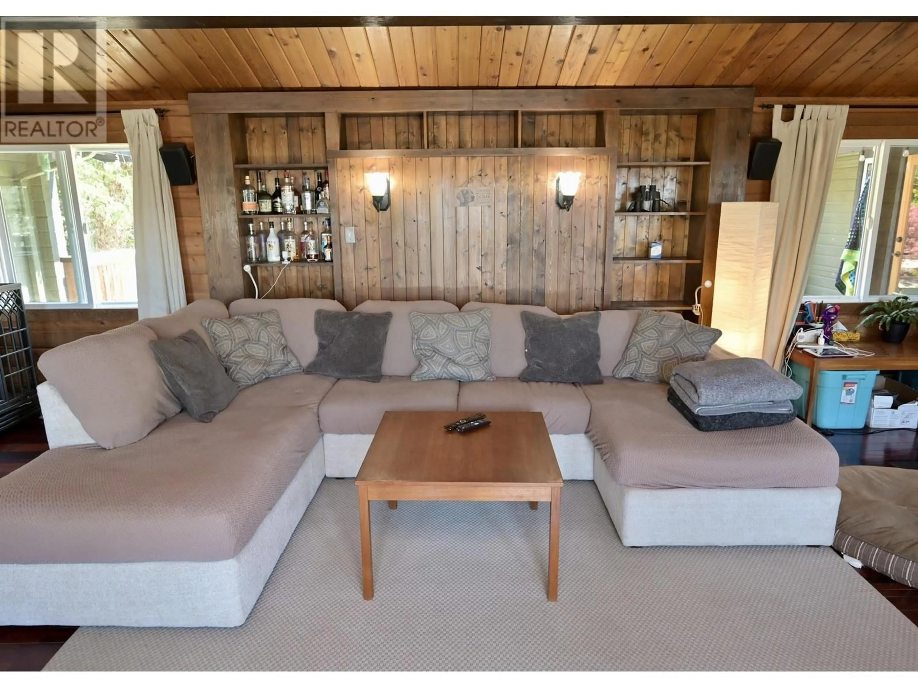 Living room with furniture, wood/laminate floor for 4184 FRANCIS PENINSULA ROAD, Pender Harbour British Columbia V0N2H1