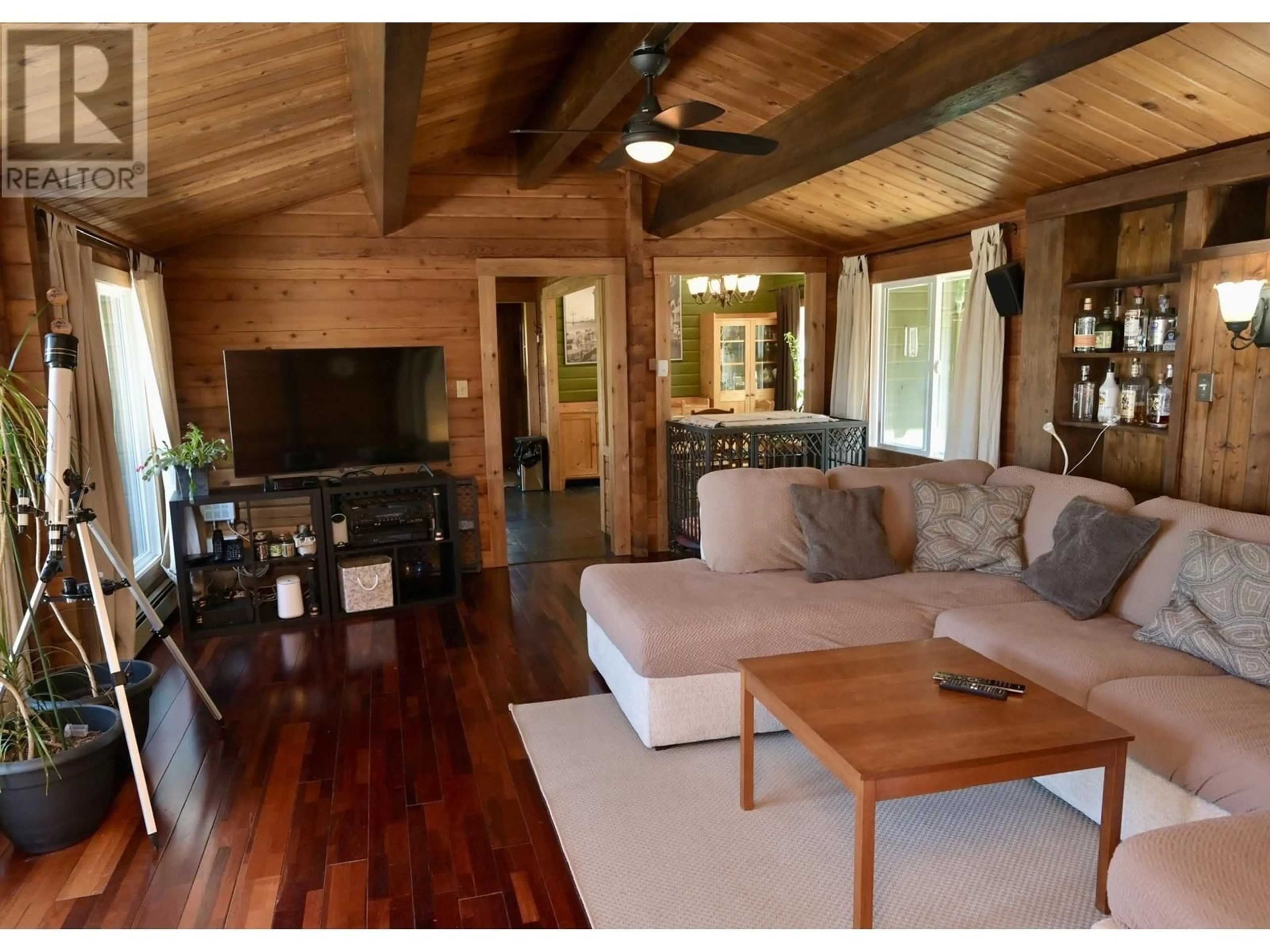 Living room with furniture, wood/laminate floor for 4184 FRANCIS PENINSULA ROAD, Pender Harbour British Columbia V0N2H1