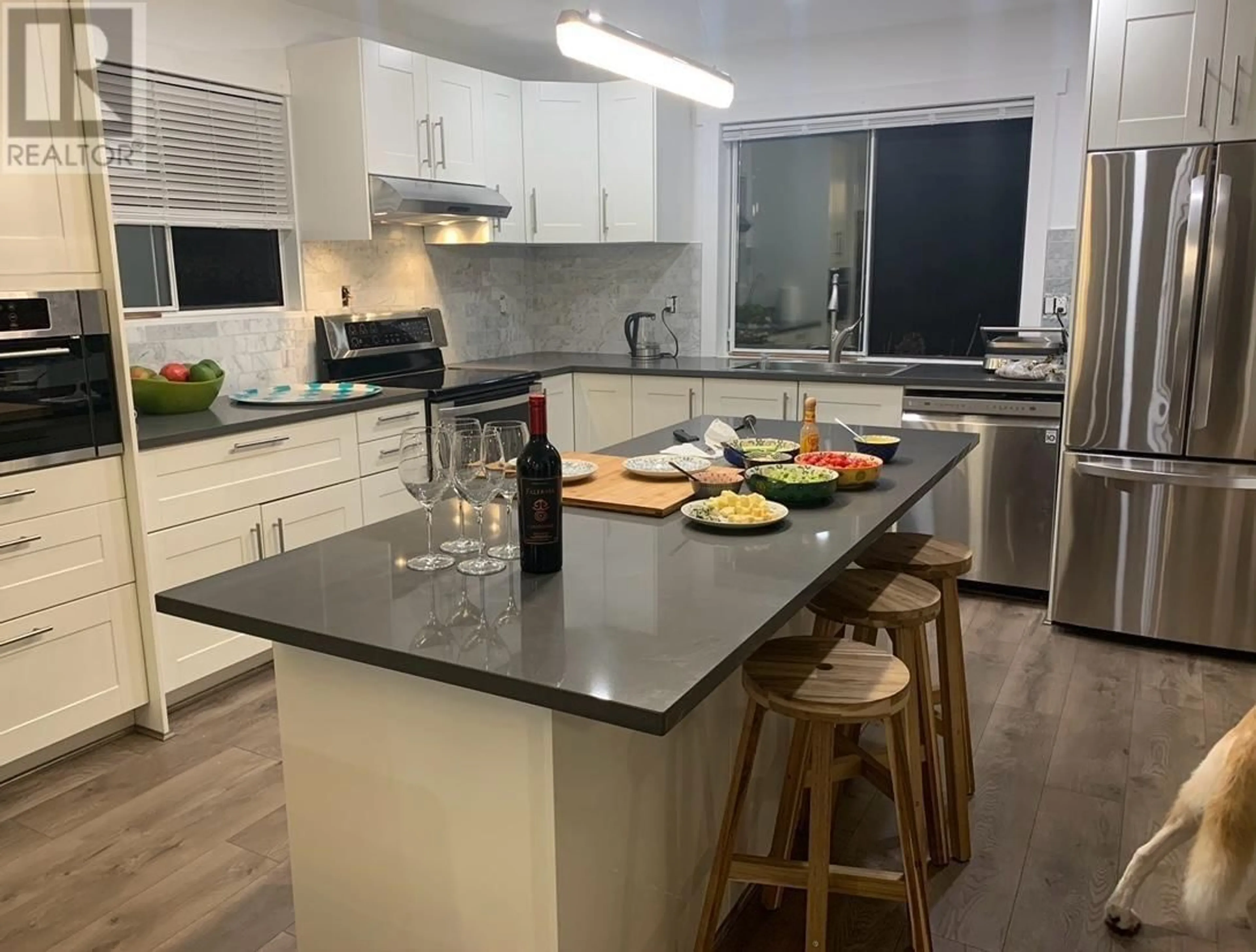 Open concept kitchen, wood/laminate floor for 1250 RIVER DRIVE, Coquitlam British Columbia V3E1Z7