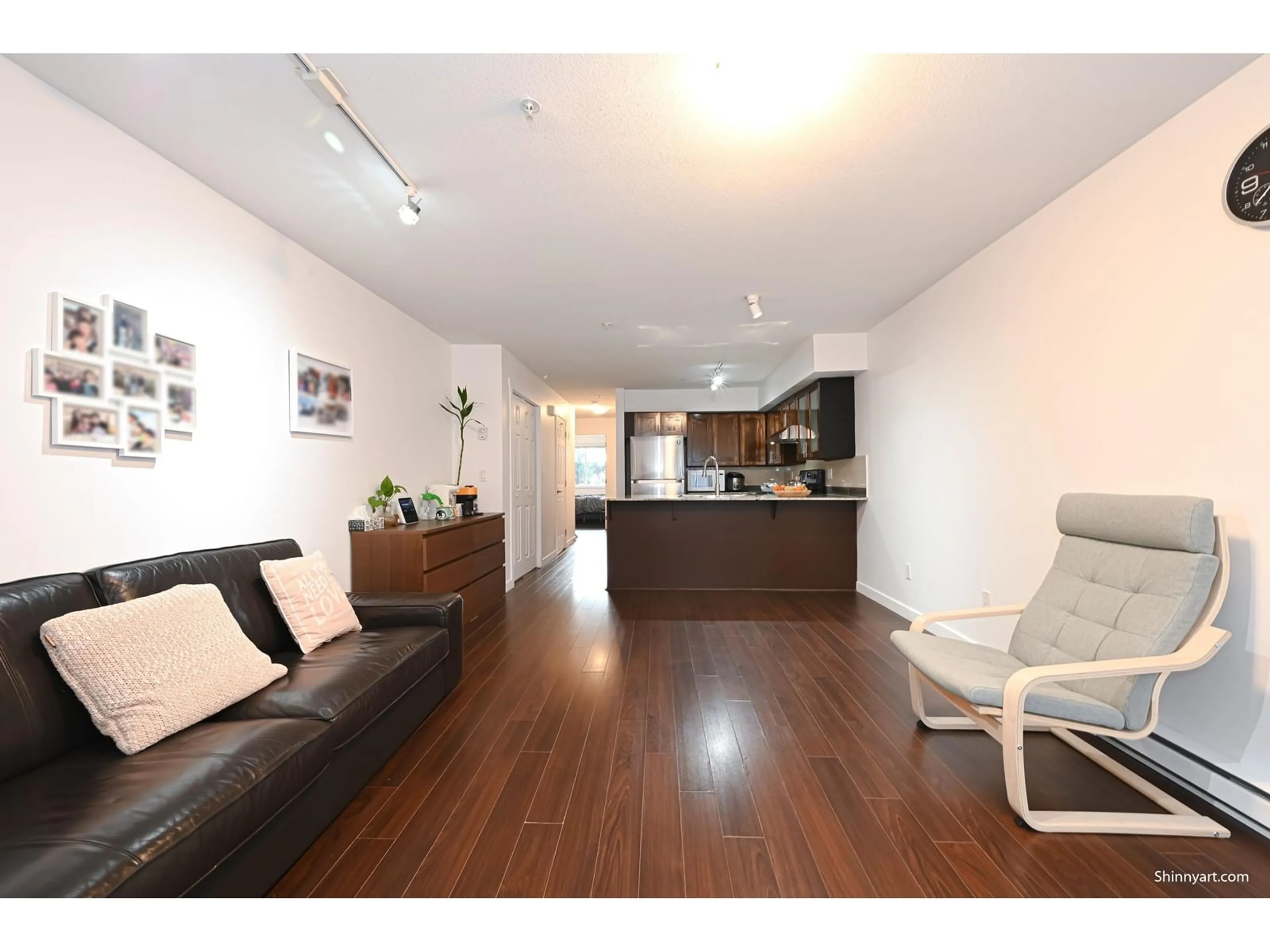 Living room with furniture, wood/laminate floor for 106 - 13958 108, Surrey British Columbia V3T0B4