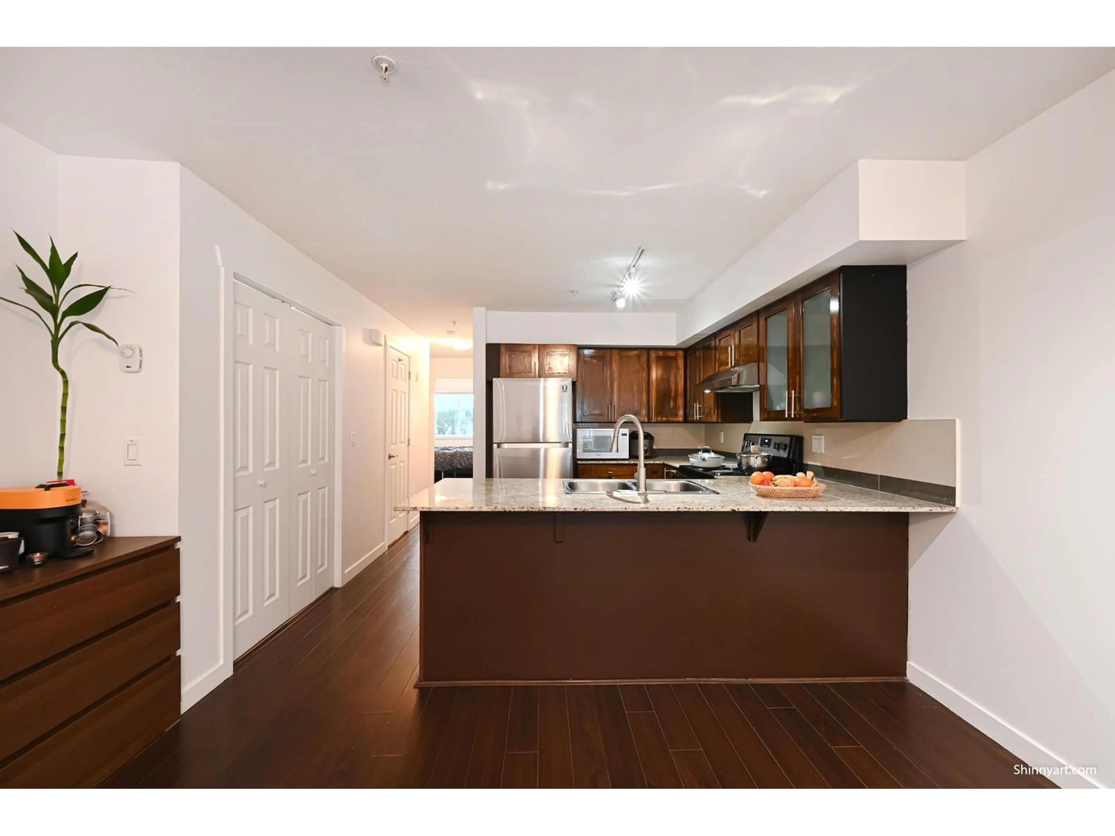 Open concept kitchen, wood/laminate floor for 106 - 13958 108, Surrey British Columbia V3T0B4