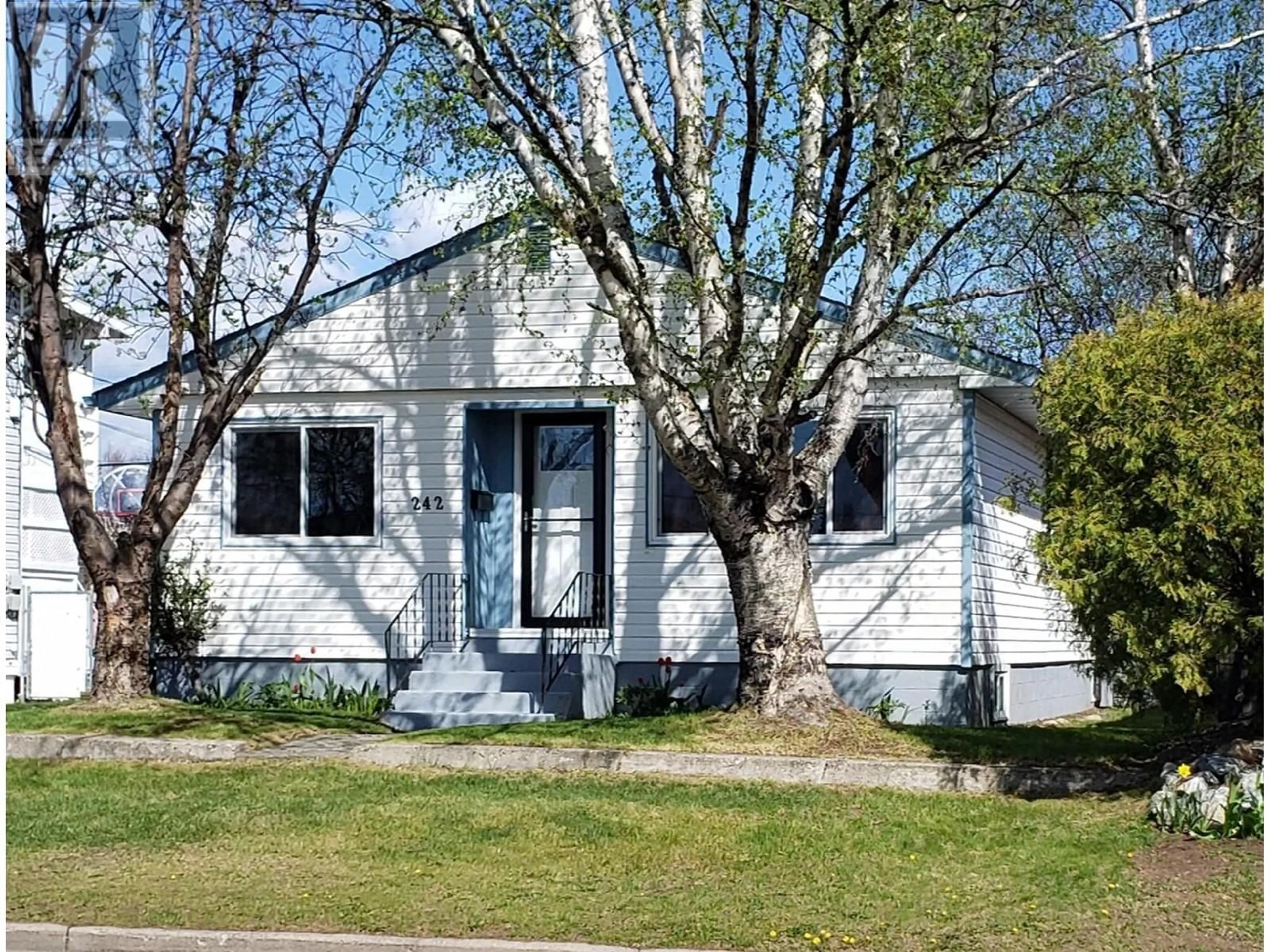 Home with vinyl exterior material, street for 242 JOHNSON STREET, Prince George British Columbia V2M2Z5