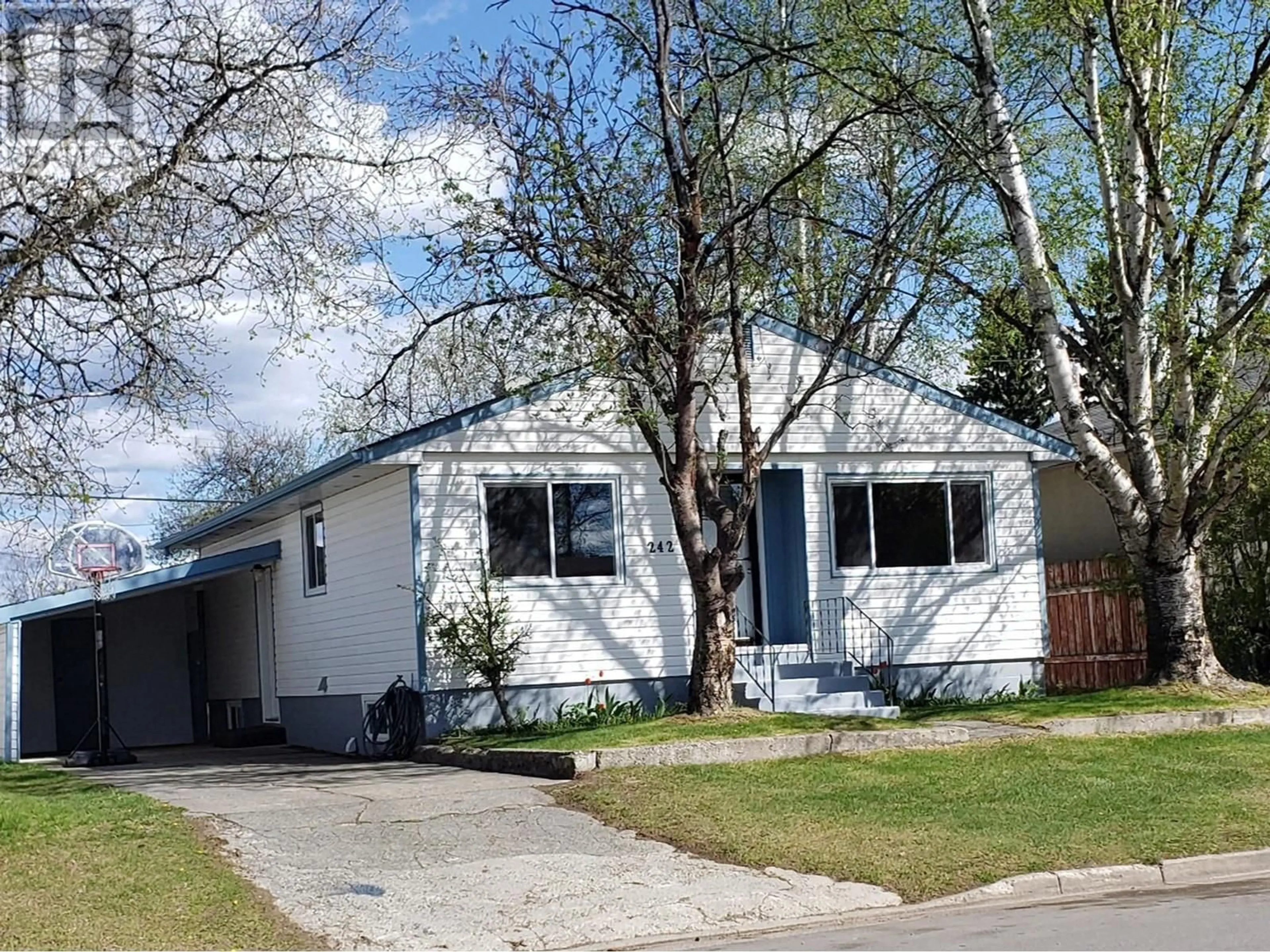 Home with vinyl exterior material, street for 242 JOHNSON STREET, Prince George British Columbia V2M2Z5