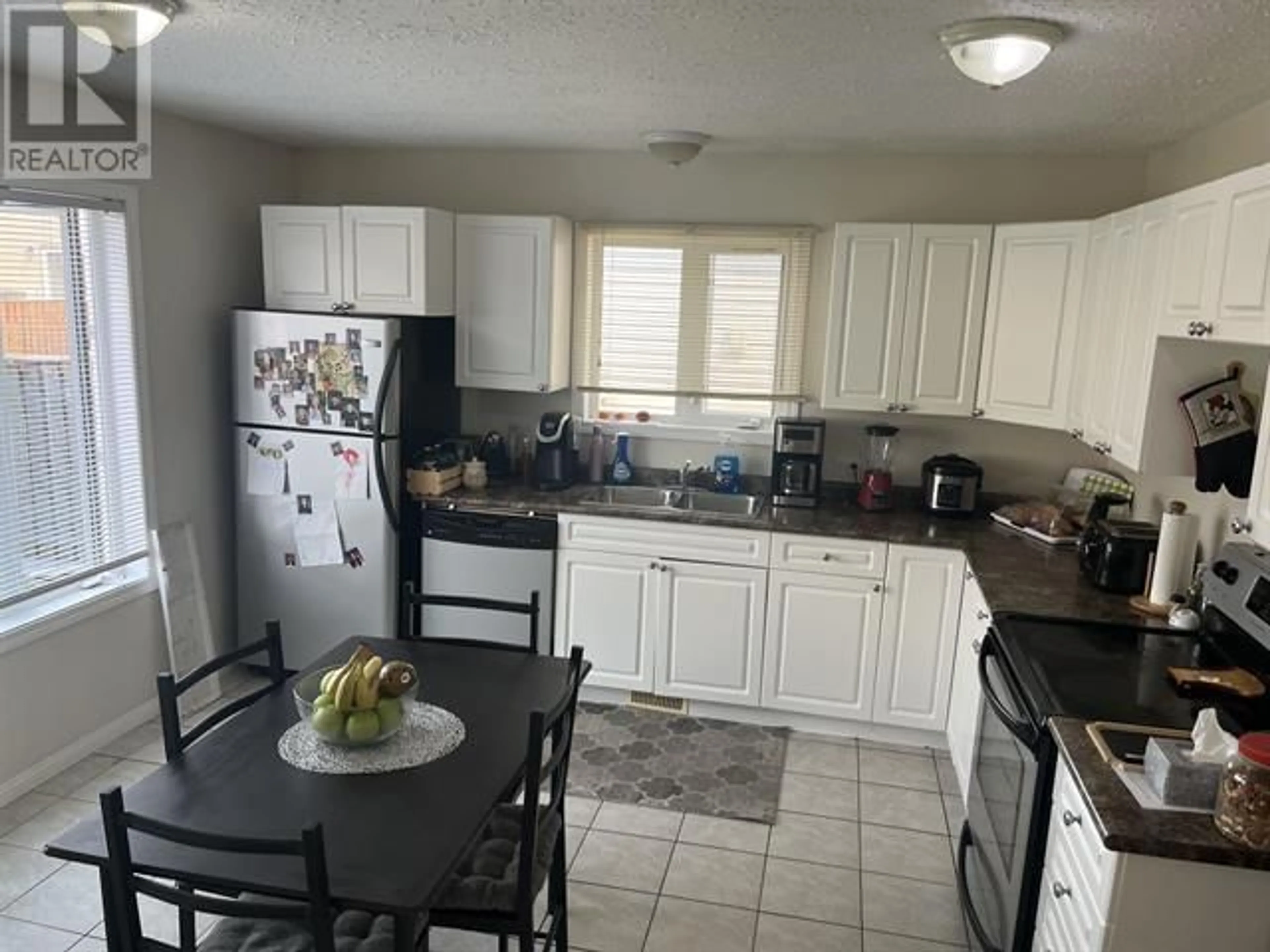 Standard kitchen, ceramic/tile floor for 8216 86 AVENUE, Fort St. John British Columbia V1J0G8