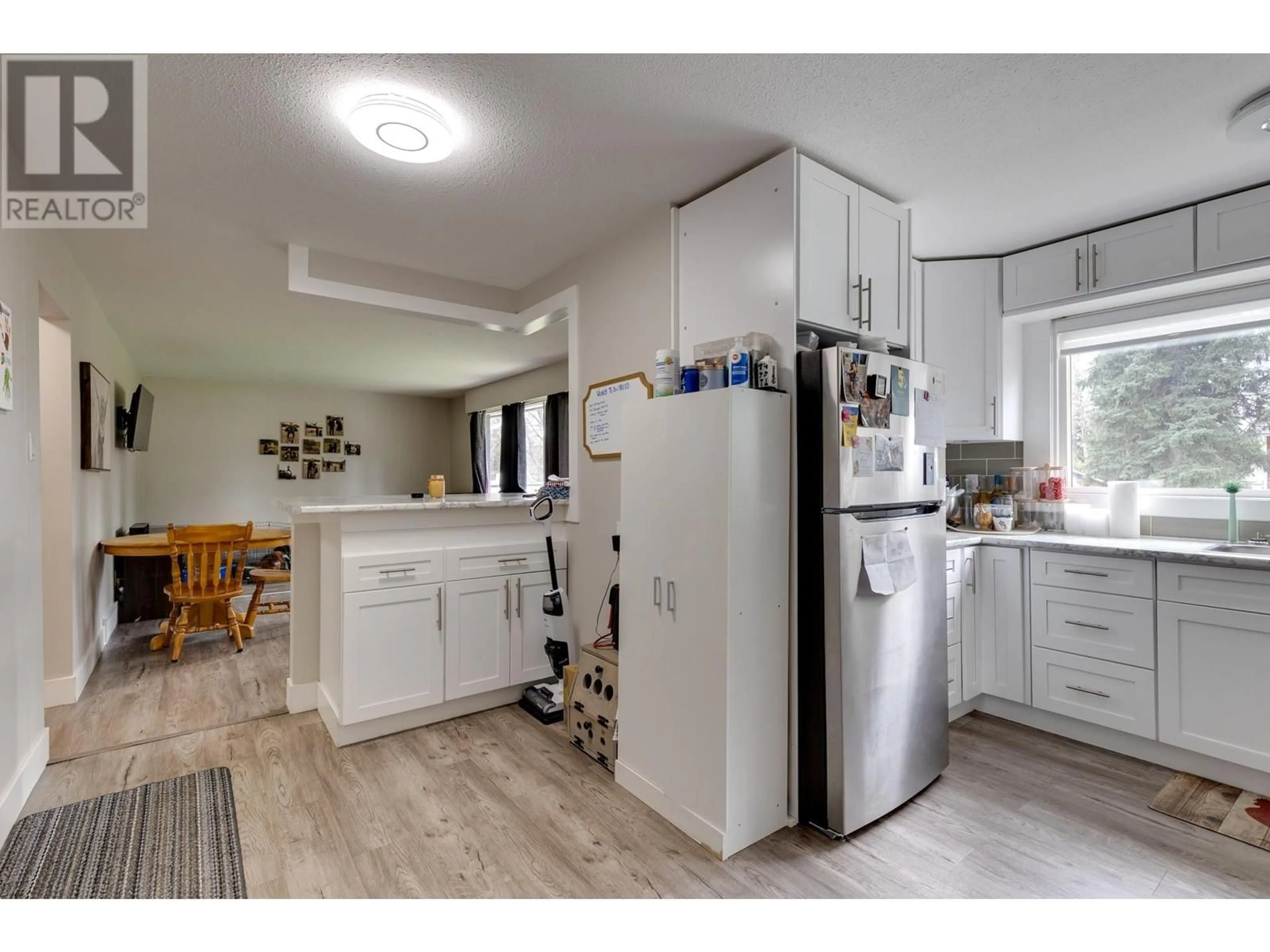 Open concept kitchen, wood/laminate floor for 3556 WILLOWDALE DRIVE, Prince George British Columbia V2K1X5