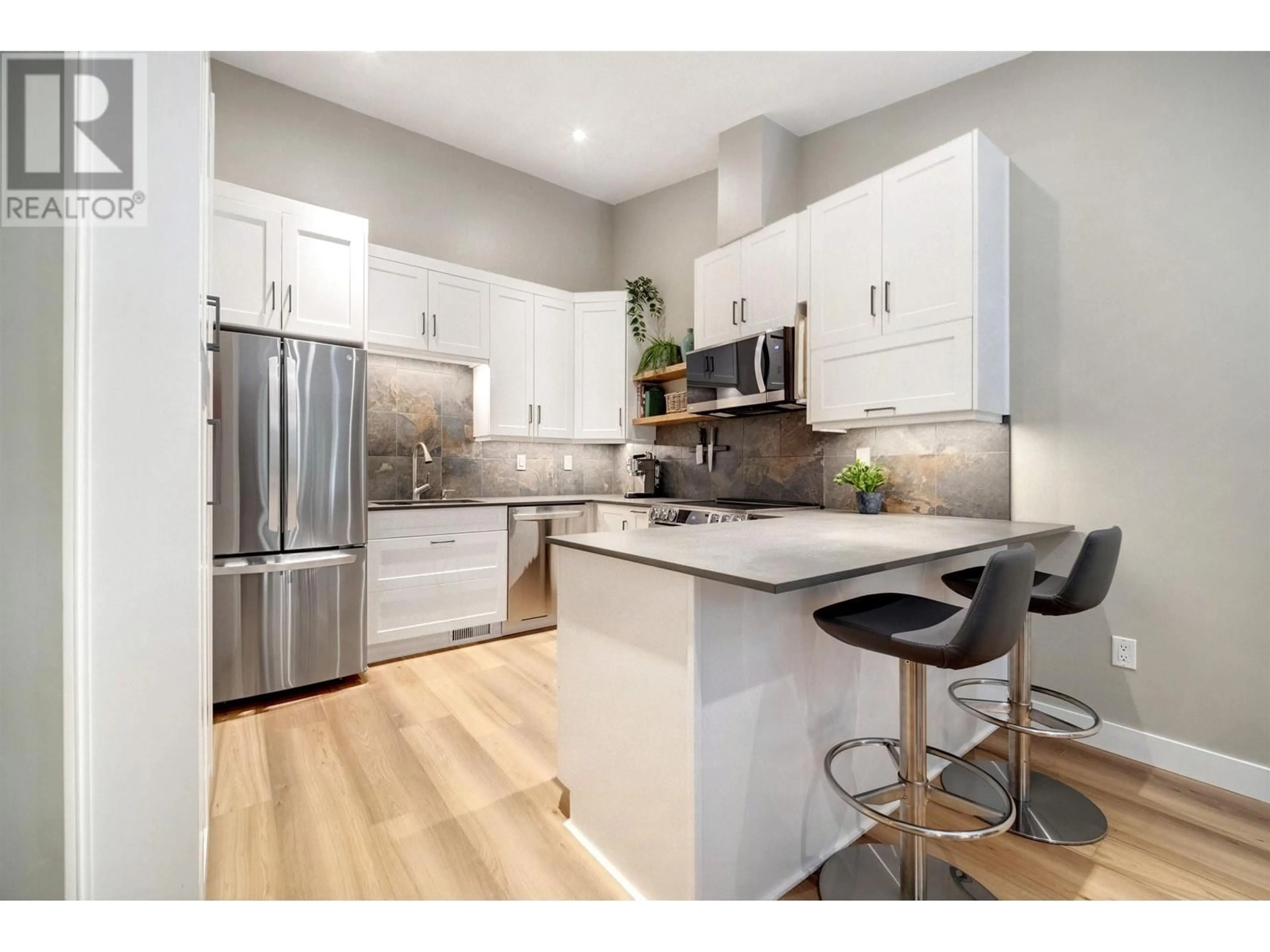 Open concept kitchen, wood/laminate floor for 3942 INDIAN RIVER DRIVE, North Vancouver British Columbia V7G2G9