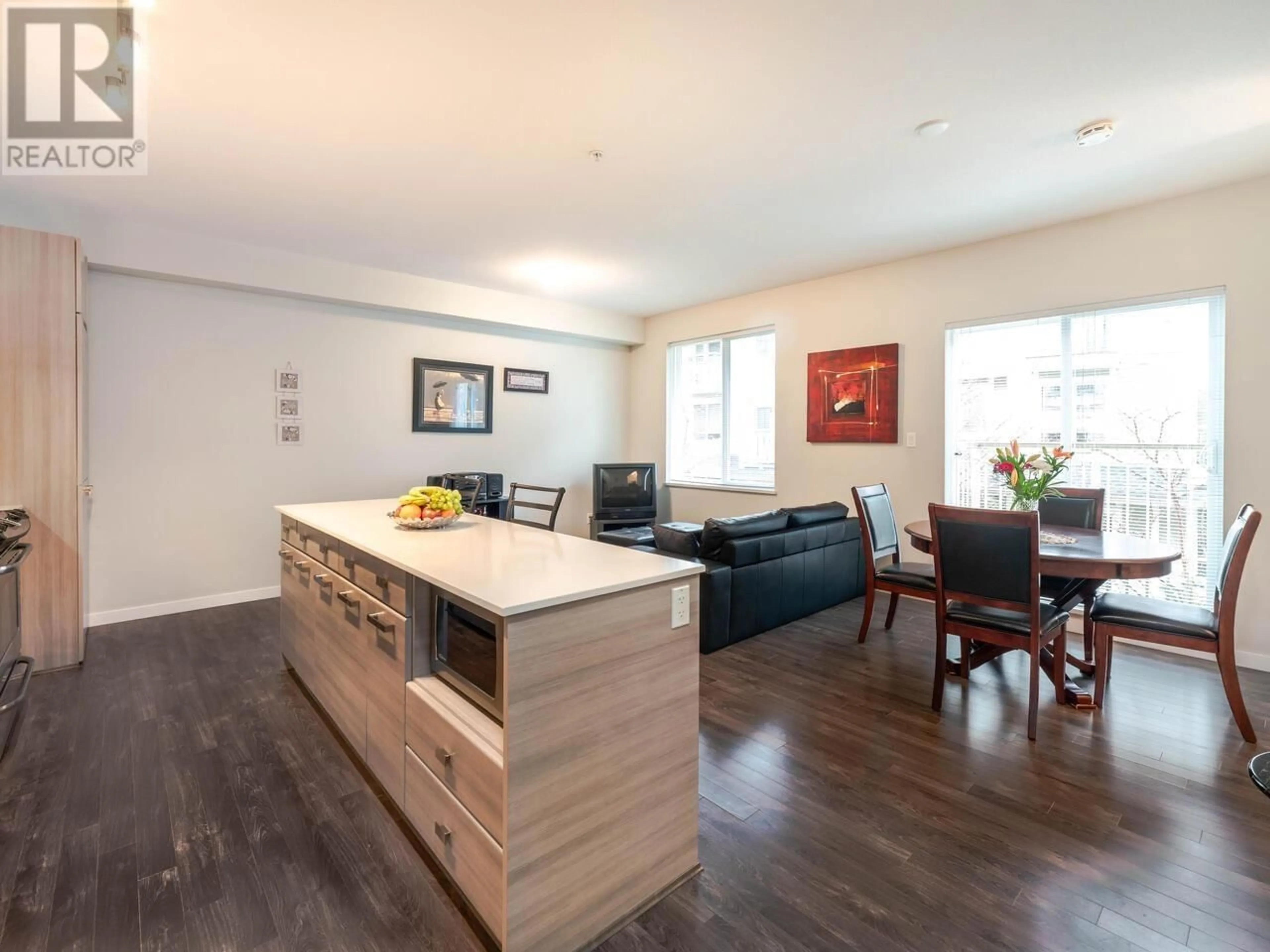 Open concept kitchen, wood/laminate floor for 12 - 6965 HASTINGS STREET, Burnaby British Columbia V5B1S9