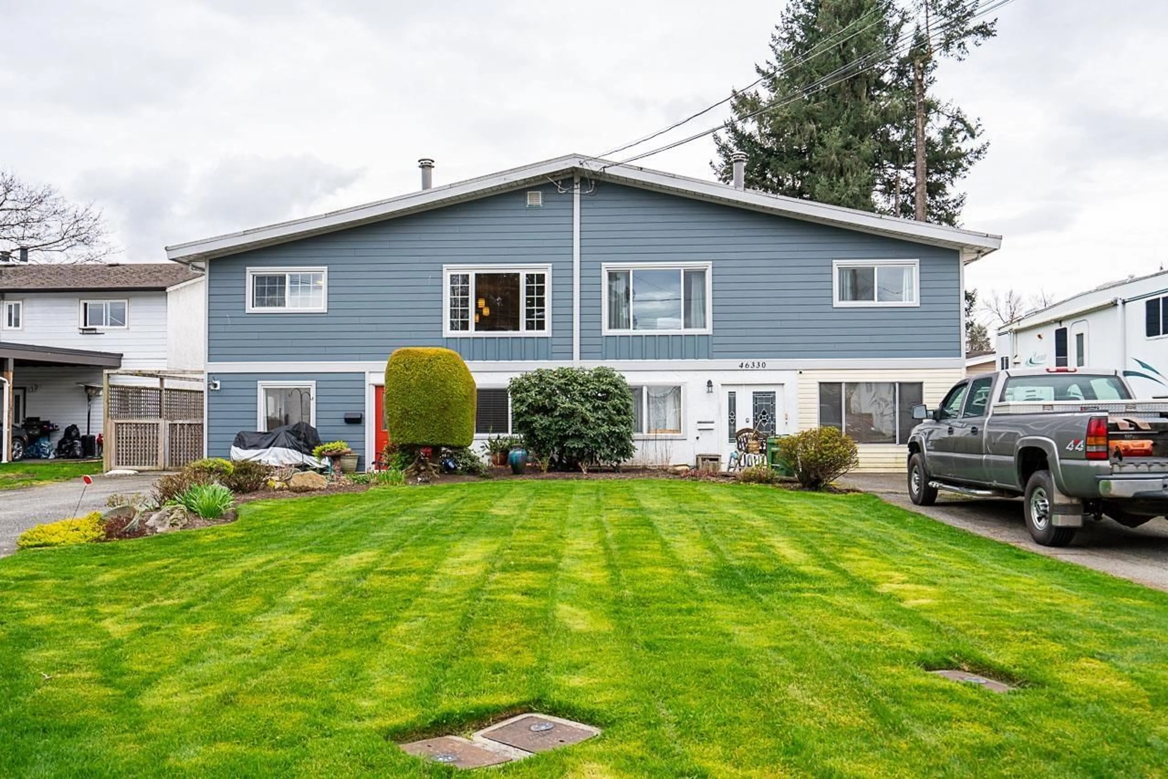 Home with vinyl exterior material, street for 46332 MCCAFFREY BOULEVARD, Chilliwack British Columbia V2P1E1