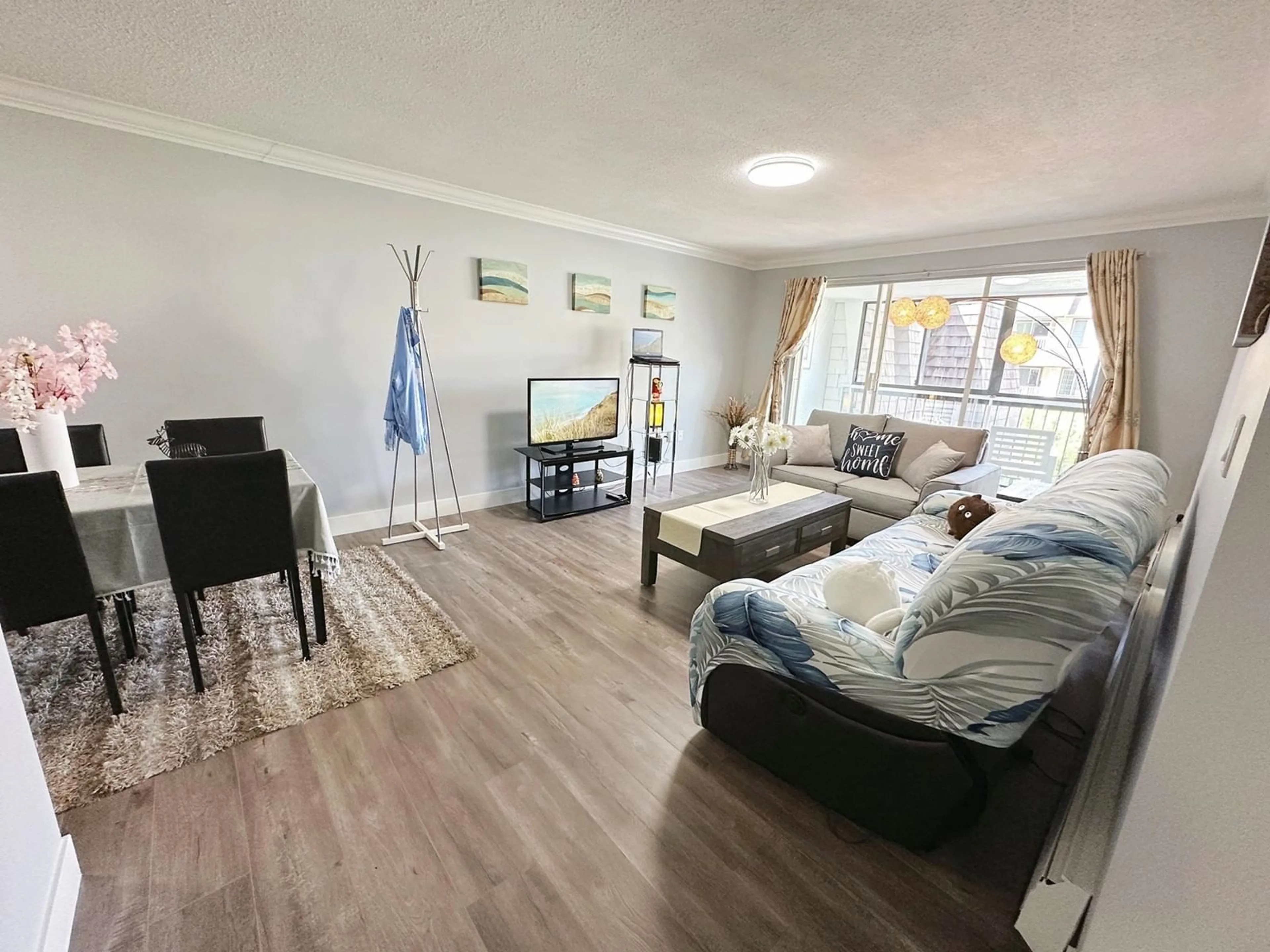 Living room with furniture, wood/laminate floor for 317 - 32175 OLD YALE, Abbotsford British Columbia V2T2C8