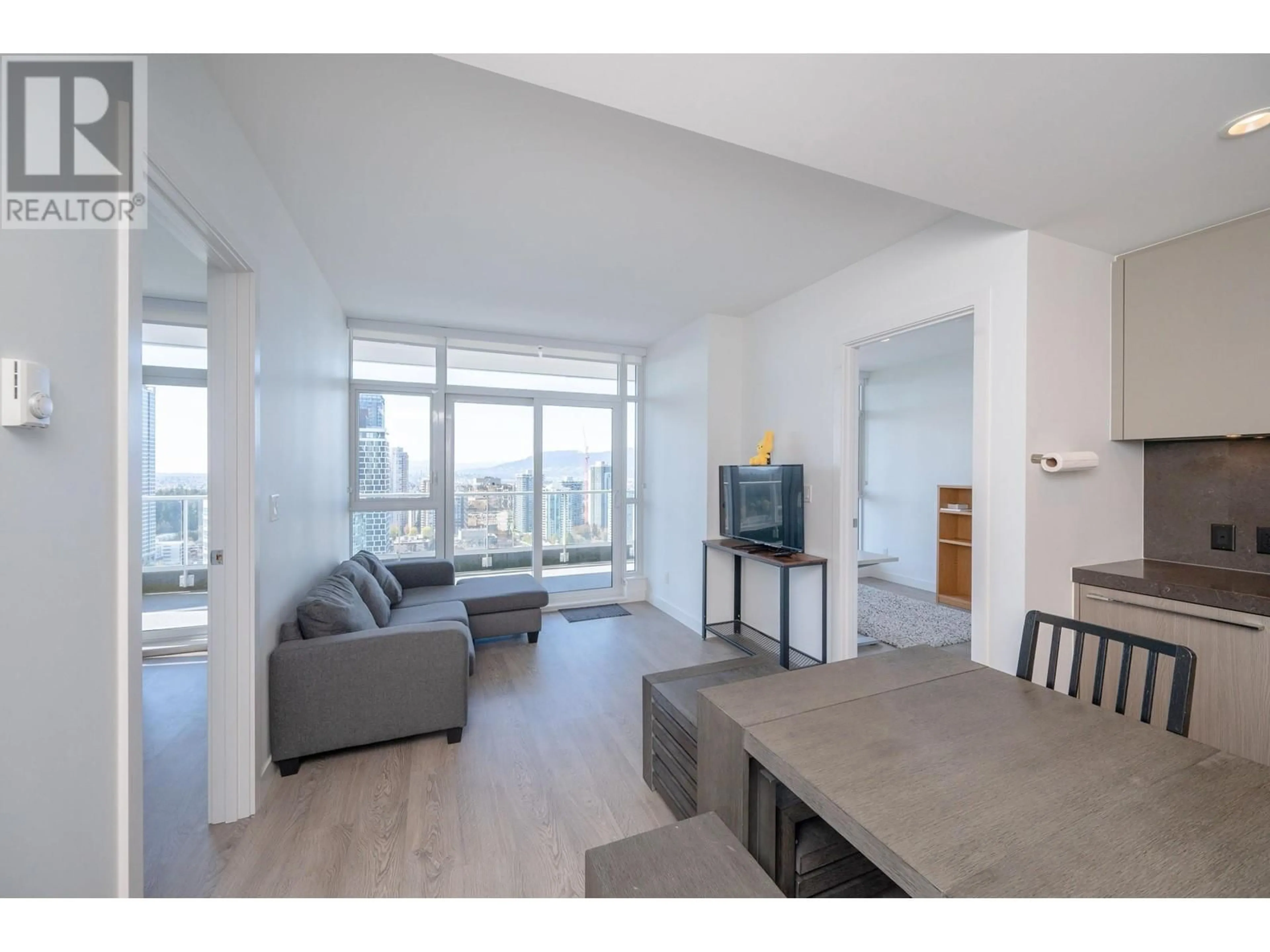 Living room with furniture, wood/laminate floor for 2503 - 6080 MCKAY AVENUE, Burnaby British Columbia V5H0J4