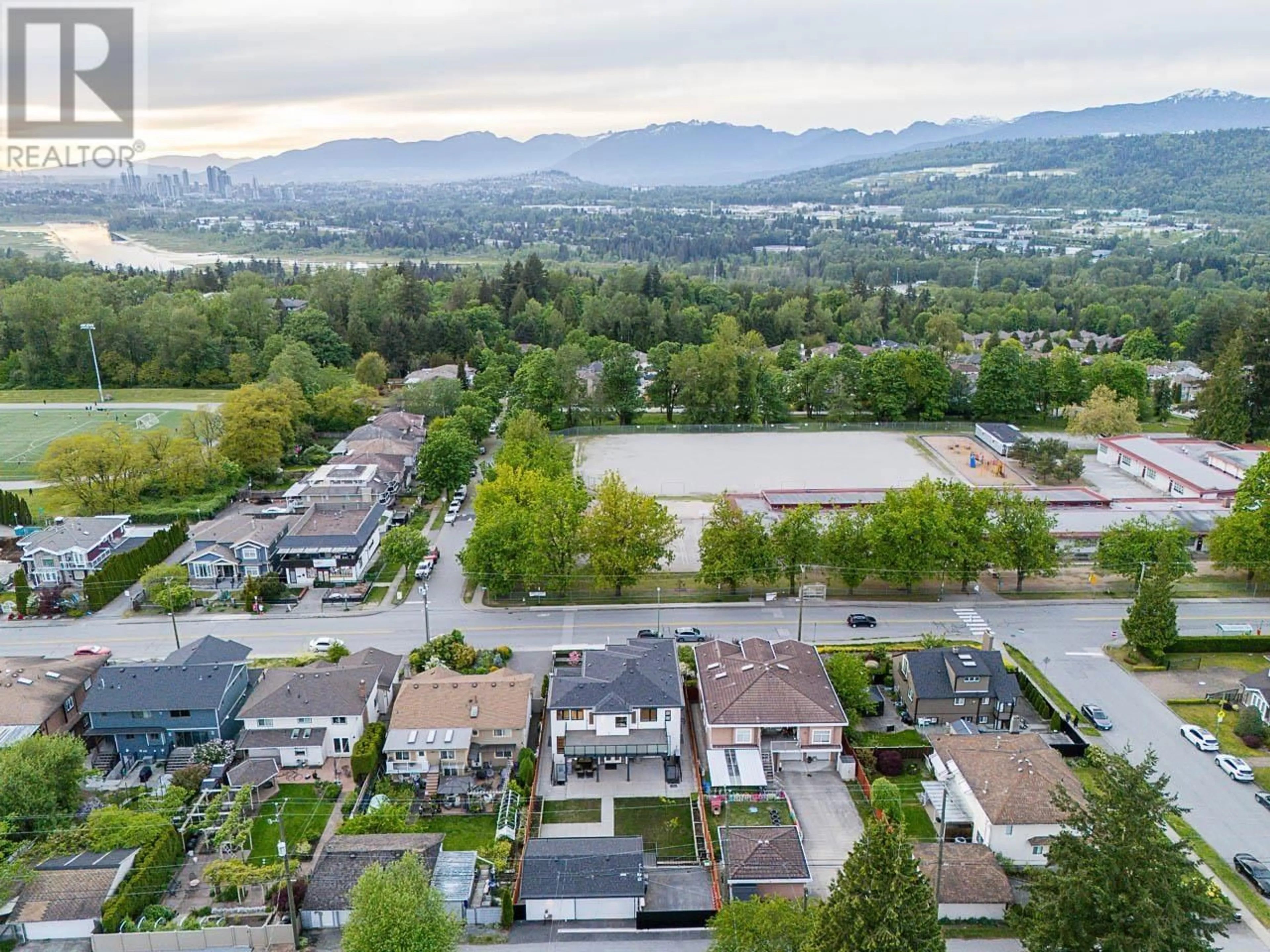 A pic from outside/outdoor area/front of a property/back of a property/a pic from drone, mountain view for 8684 ARMSTRONG AVENUE, Burnaby British Columbia V3N2H6