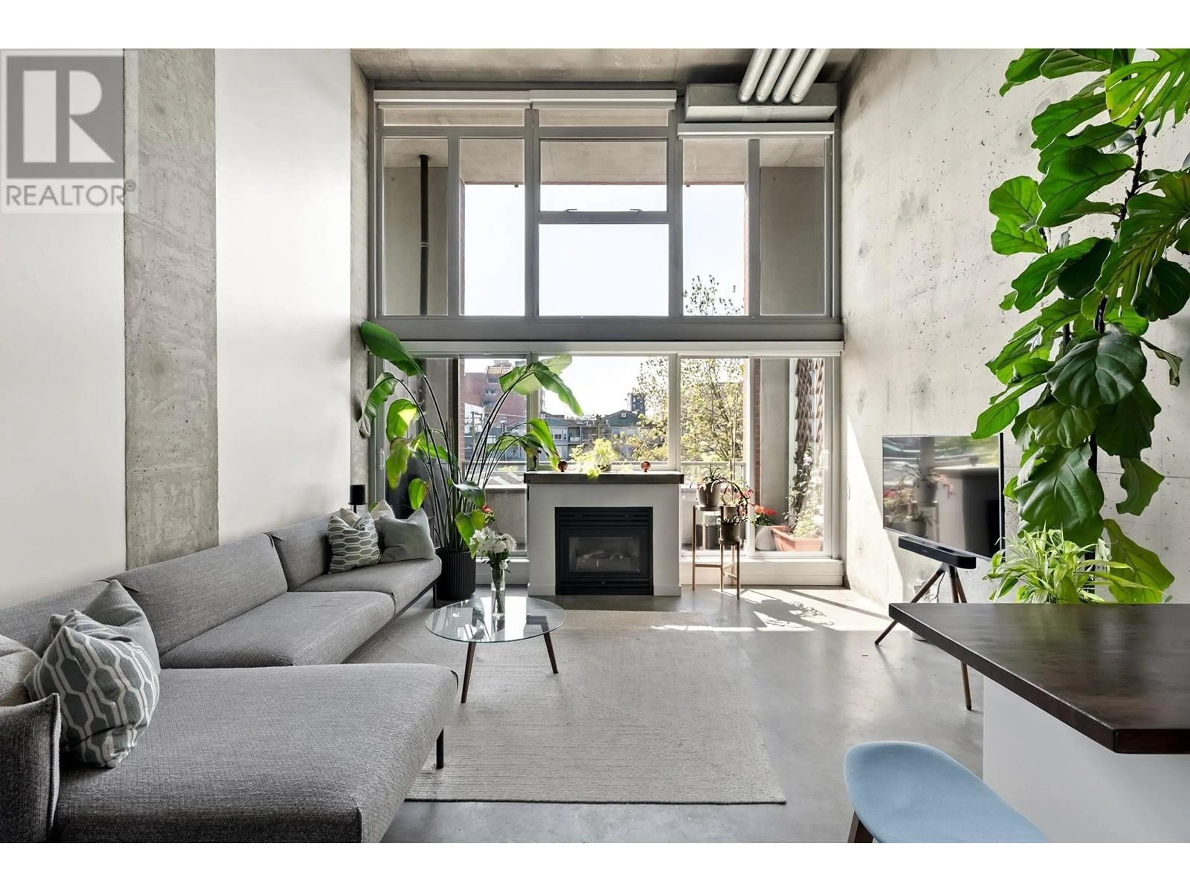 Living room with furniture, cement floor for 414 - 289 ALEXANDER STREET, Vancouver British Columbia V6A1C2