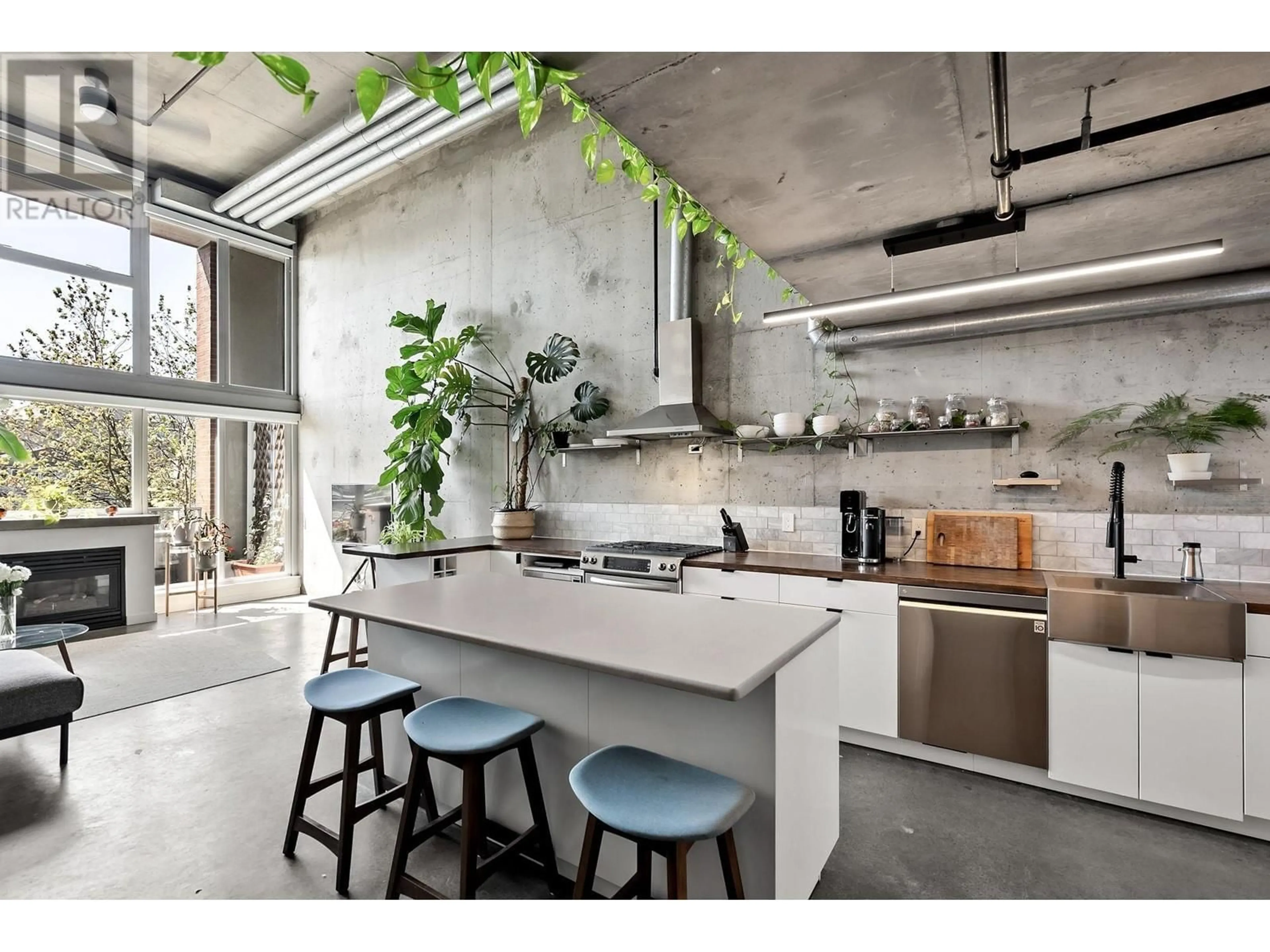 Open concept kitchen, cement floor for 414 - 289 ALEXANDER STREET, Vancouver British Columbia V6A1C2