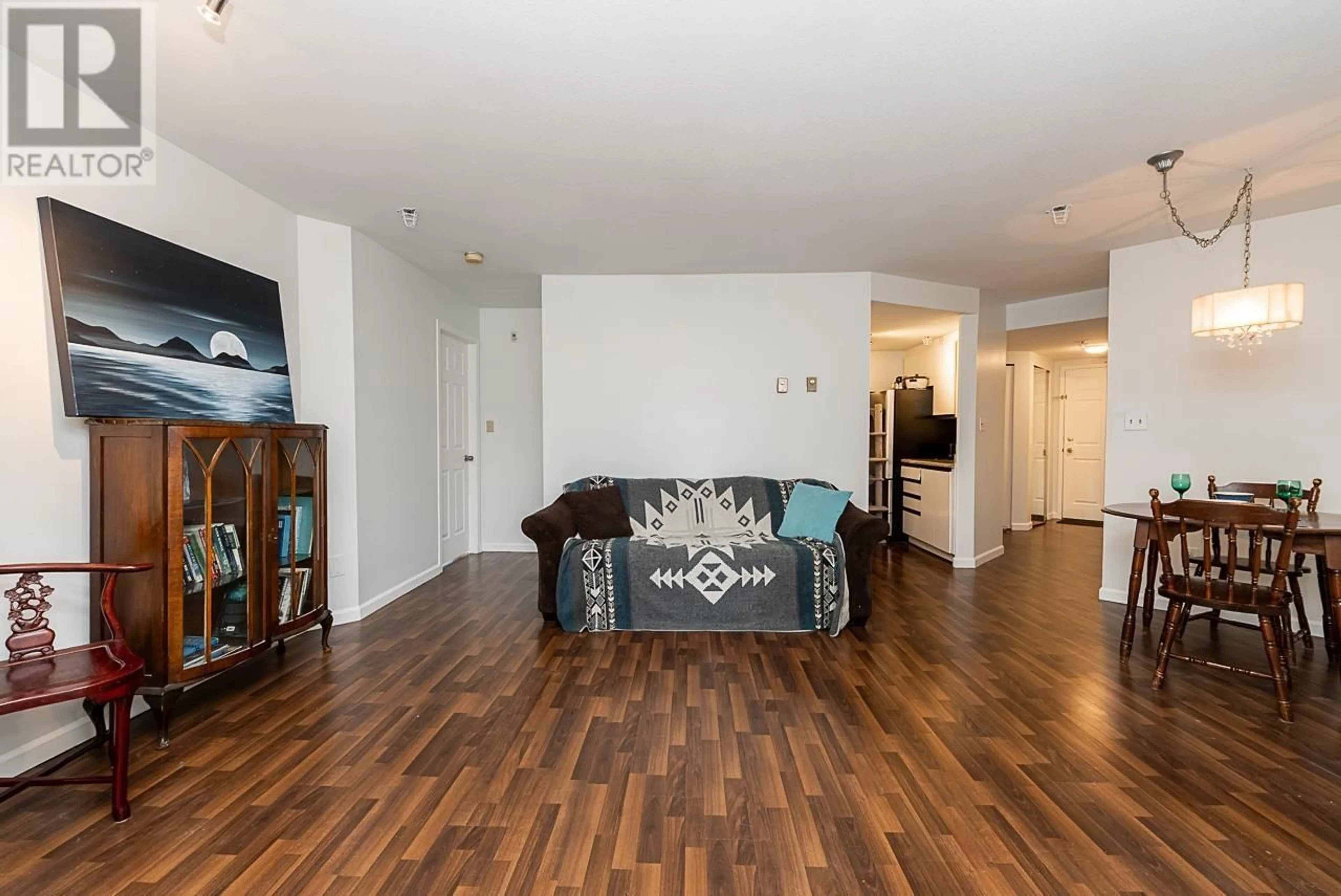 Living room with furniture, wood/laminate floor for 201 - 2023 FRANKLIN STREET, Vancouver British Columbia V5L1R4