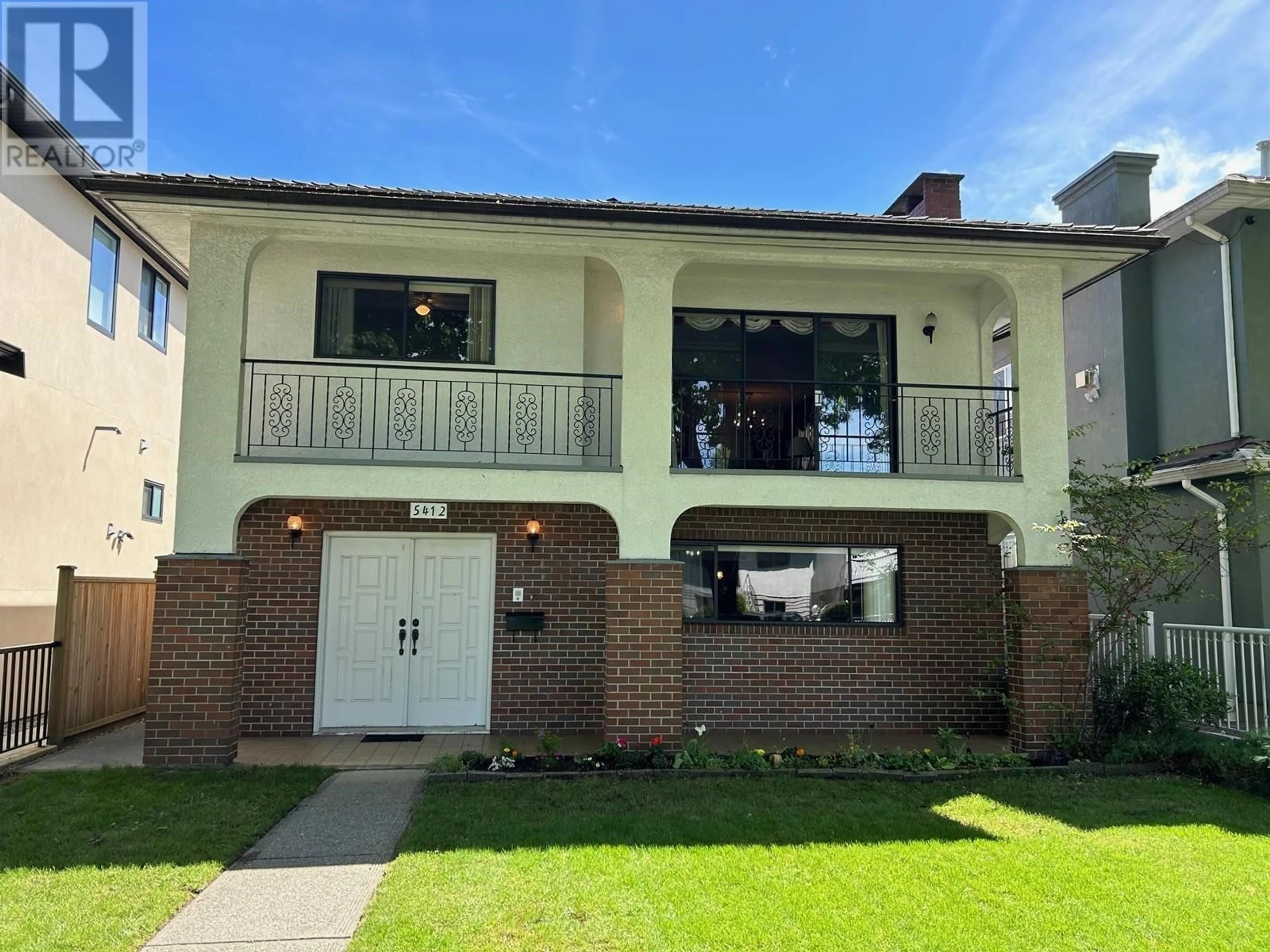 Home with brick exterior material, street for 5412 RHODES STREET, Vancouver British Columbia V5R3N9