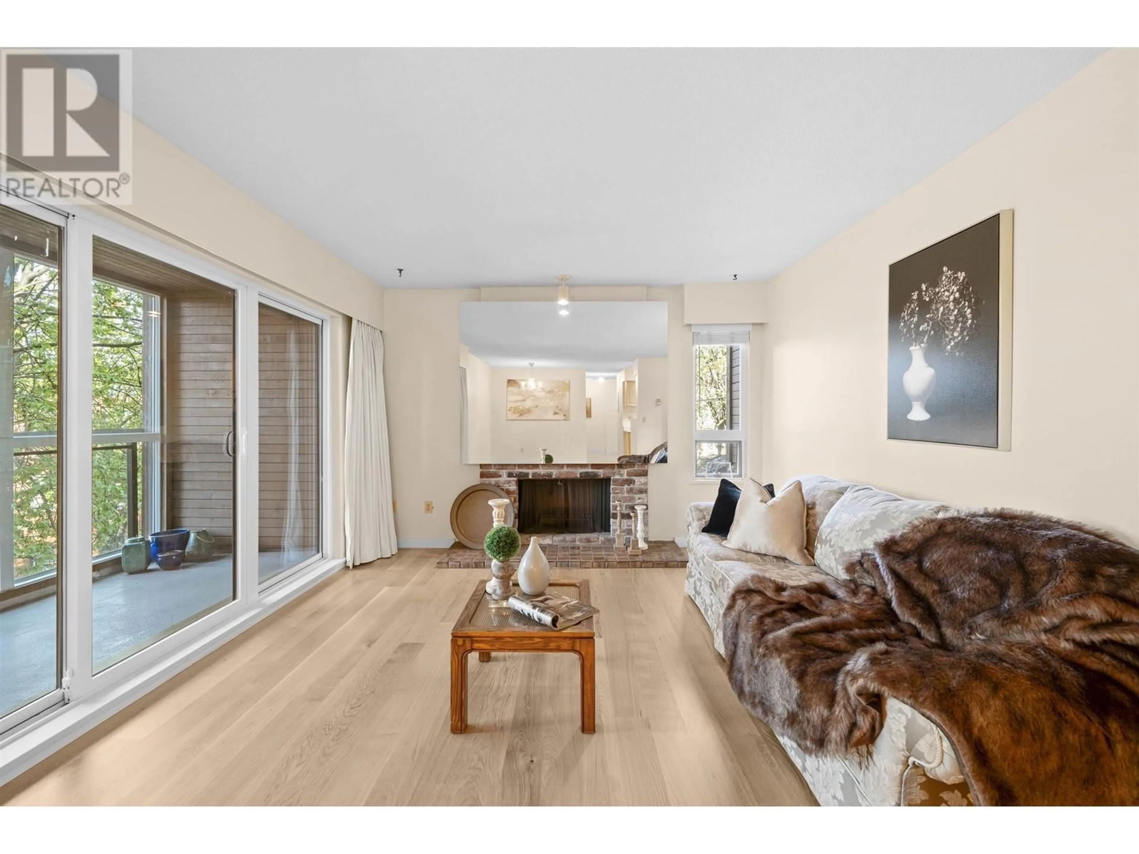 Living room with furniture, wood/laminate floor for 303 - 2410 CORNWALL AVENUE, Vancouver British Columbia V6K1B8