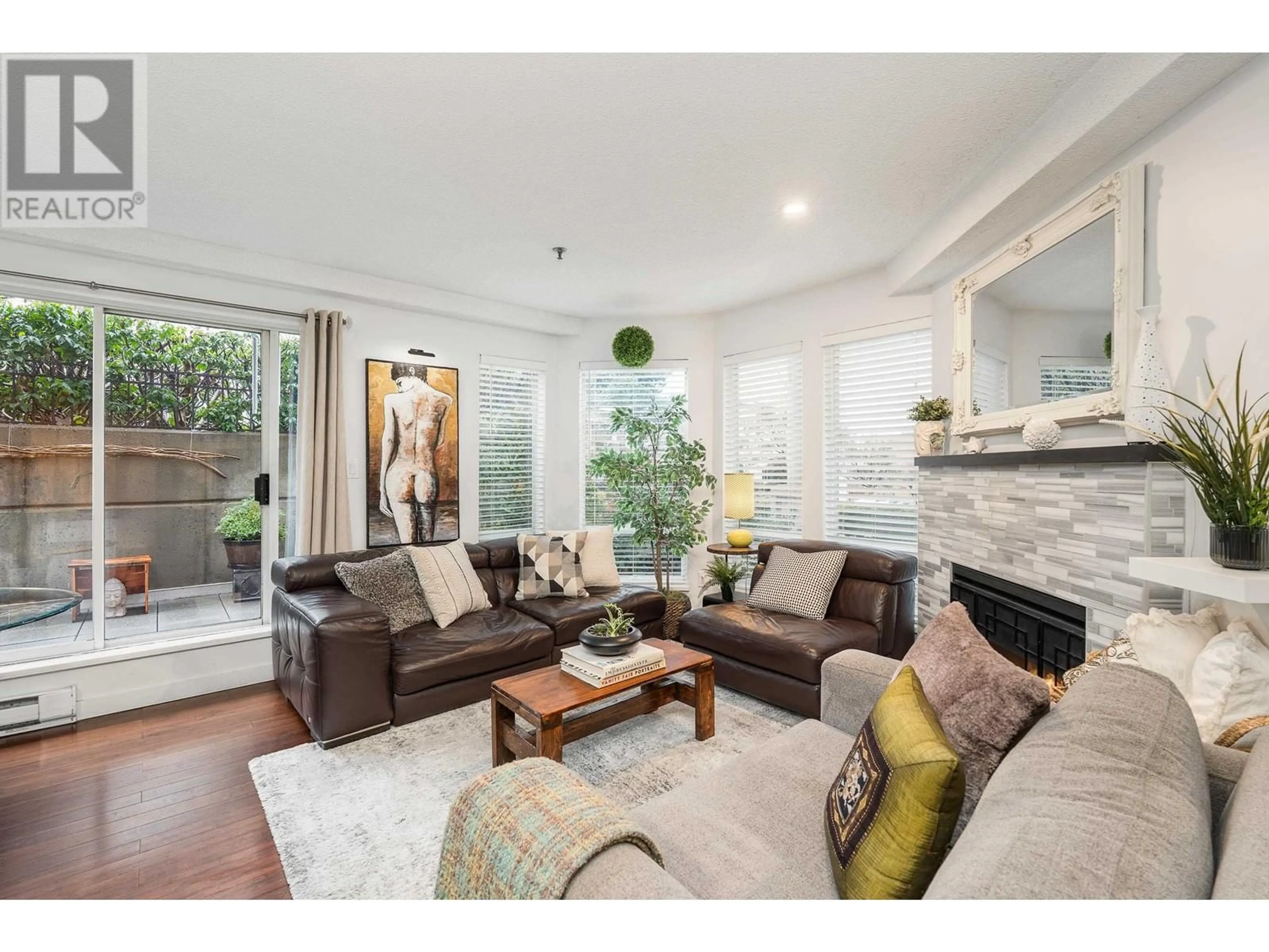 Living room with furniture, wood/laminate floor for 104 - 1988 MAPLE STREET, Vancouver British Columbia V6J3T1