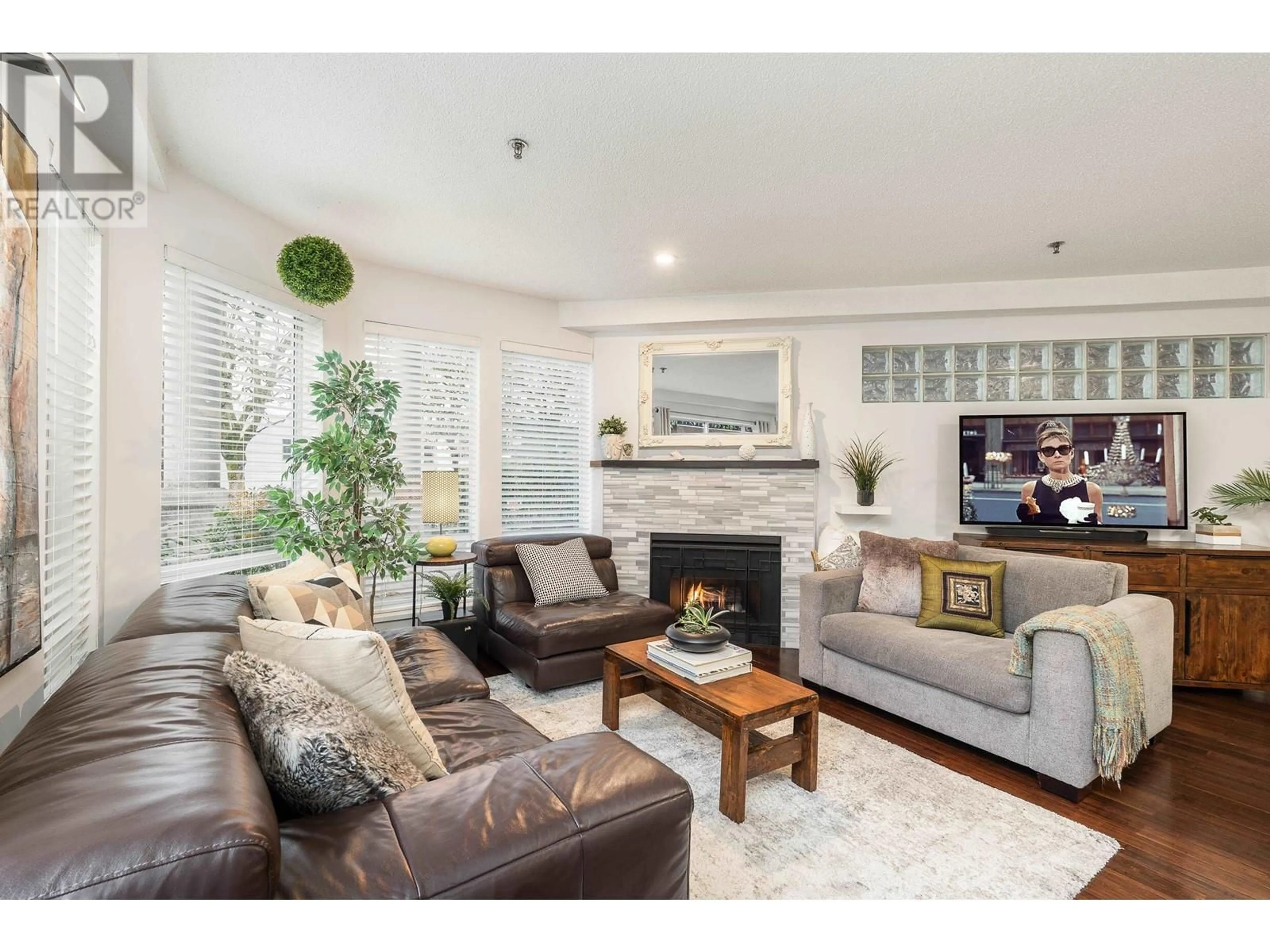 Living room with furniture, wood/laminate floor for 104 - 1988 MAPLE STREET, Vancouver British Columbia V6J3T1