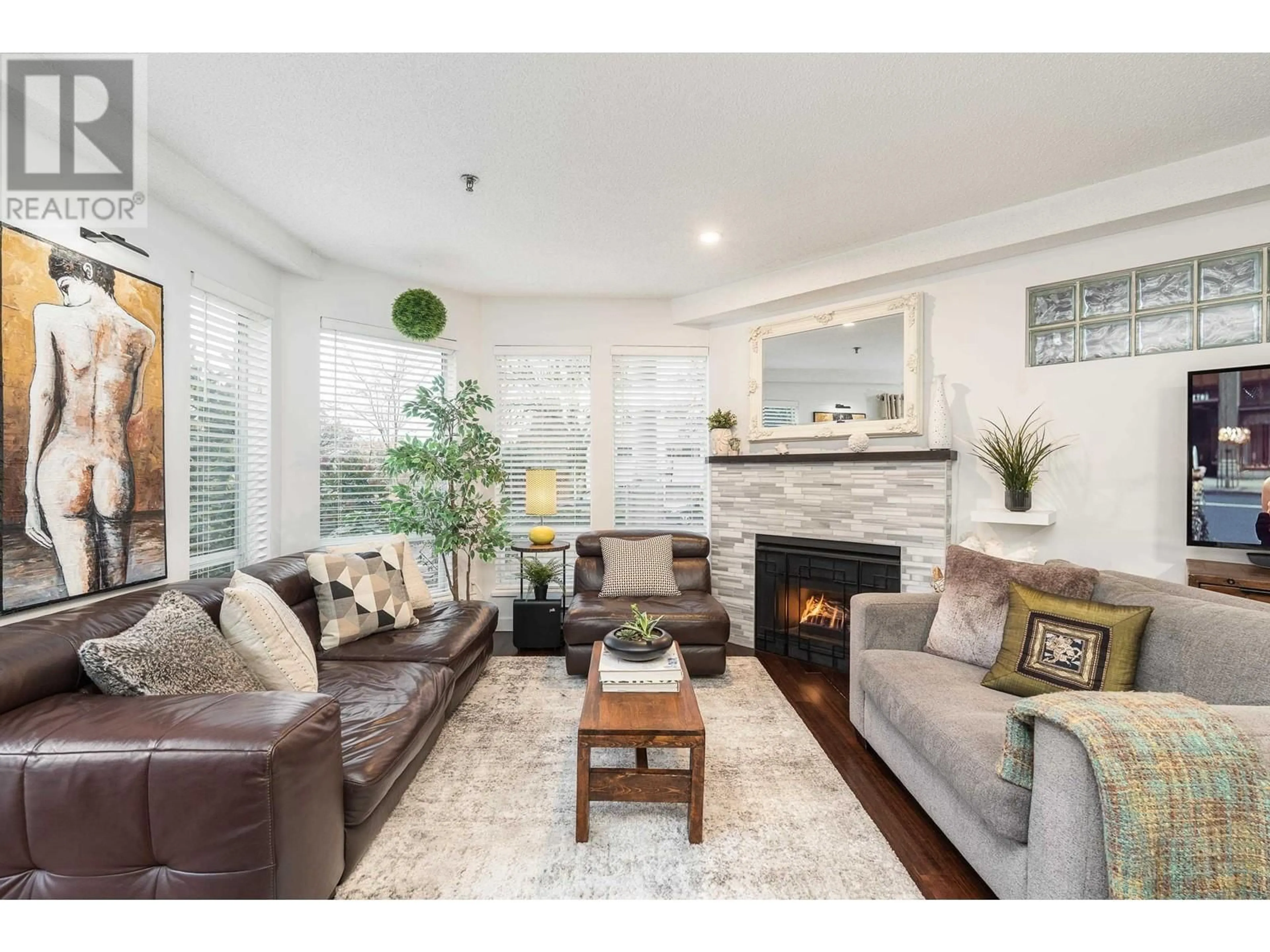 Living room with furniture, wood/laminate floor for 104 - 1988 MAPLE STREET, Vancouver British Columbia V6J3T1