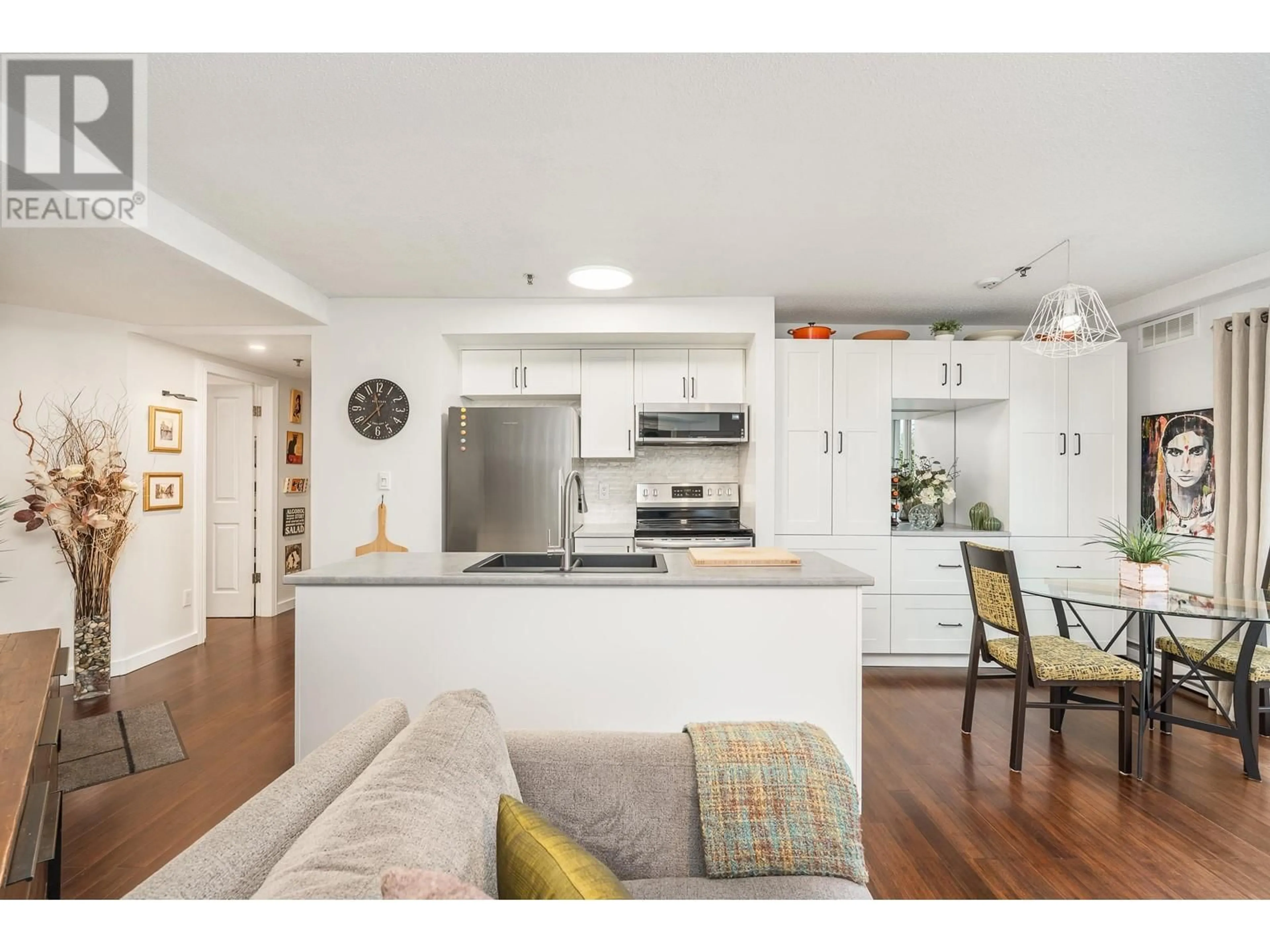Open concept kitchen, wood/laminate floor for 104 - 1988 MAPLE STREET, Vancouver British Columbia V6J3T1