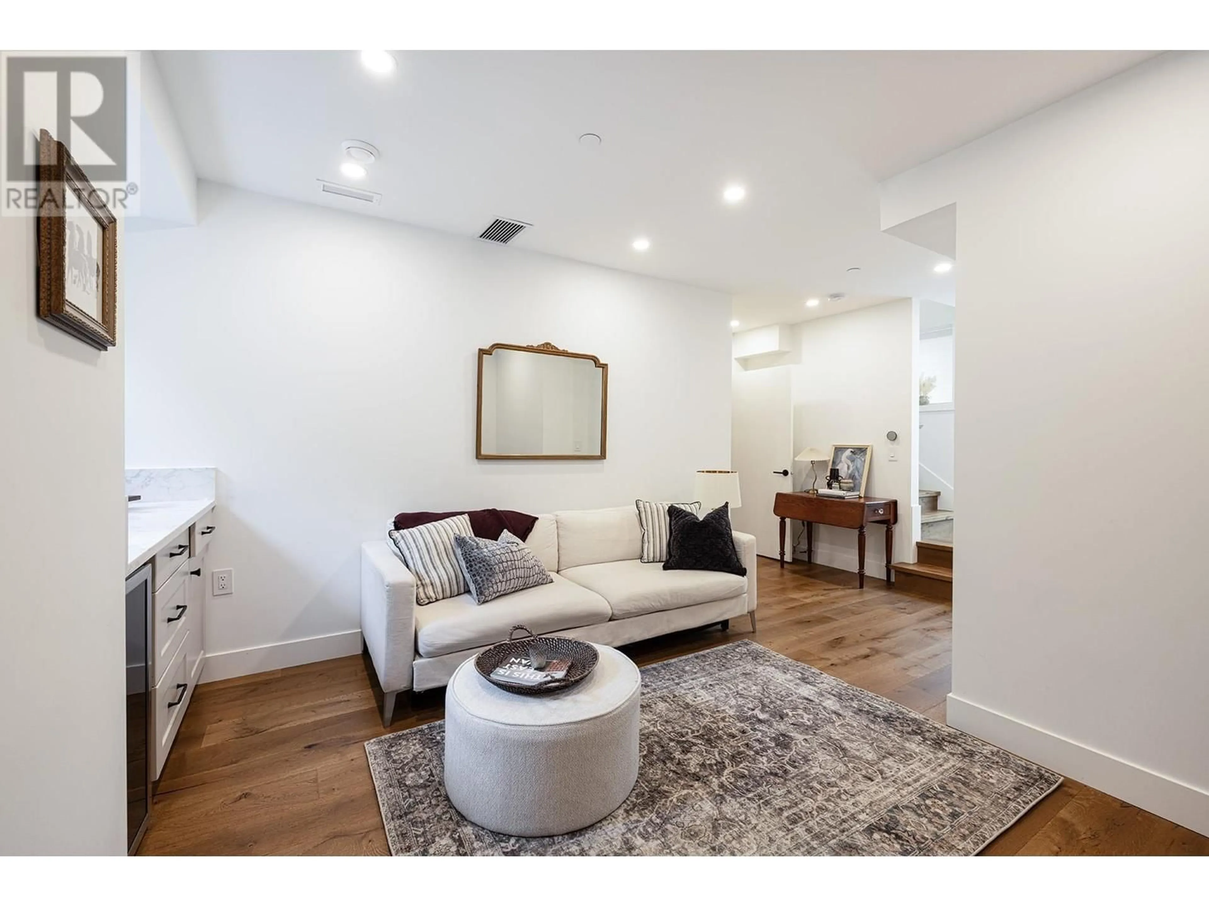 Living room with furniture, wood/laminate floor for 5471 WALES STREET, Vancouver British Columbia V5R3M9