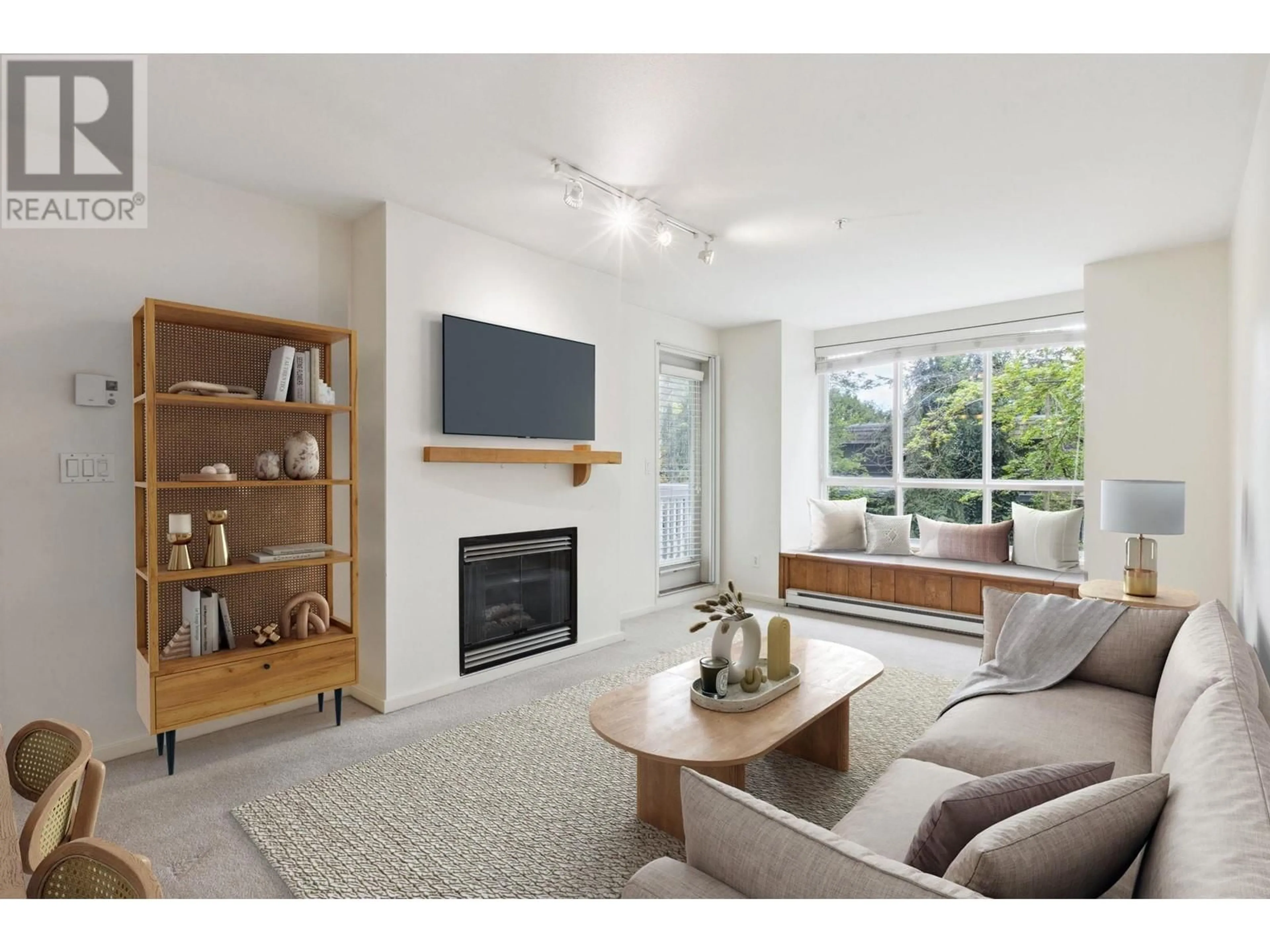 Living room with furniture, unknown for 212 - 1111 LYNN VALLEY ROAD, North Vancouver British Columbia V7J3V4