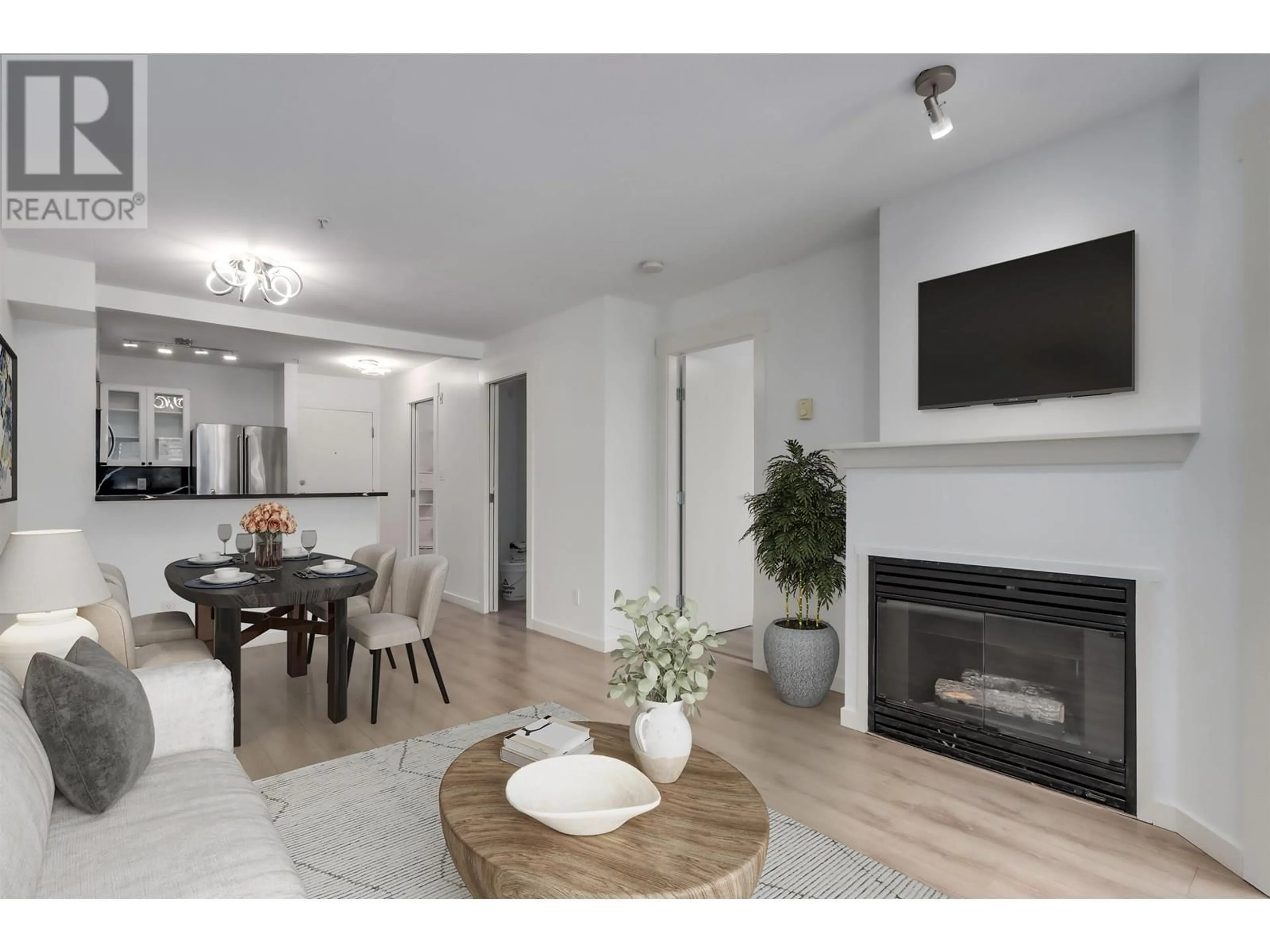 Living room with furniture, wood/laminate floor for 209 - 1503 65TH AVENUE, Vancouver British Columbia V6P6Y8