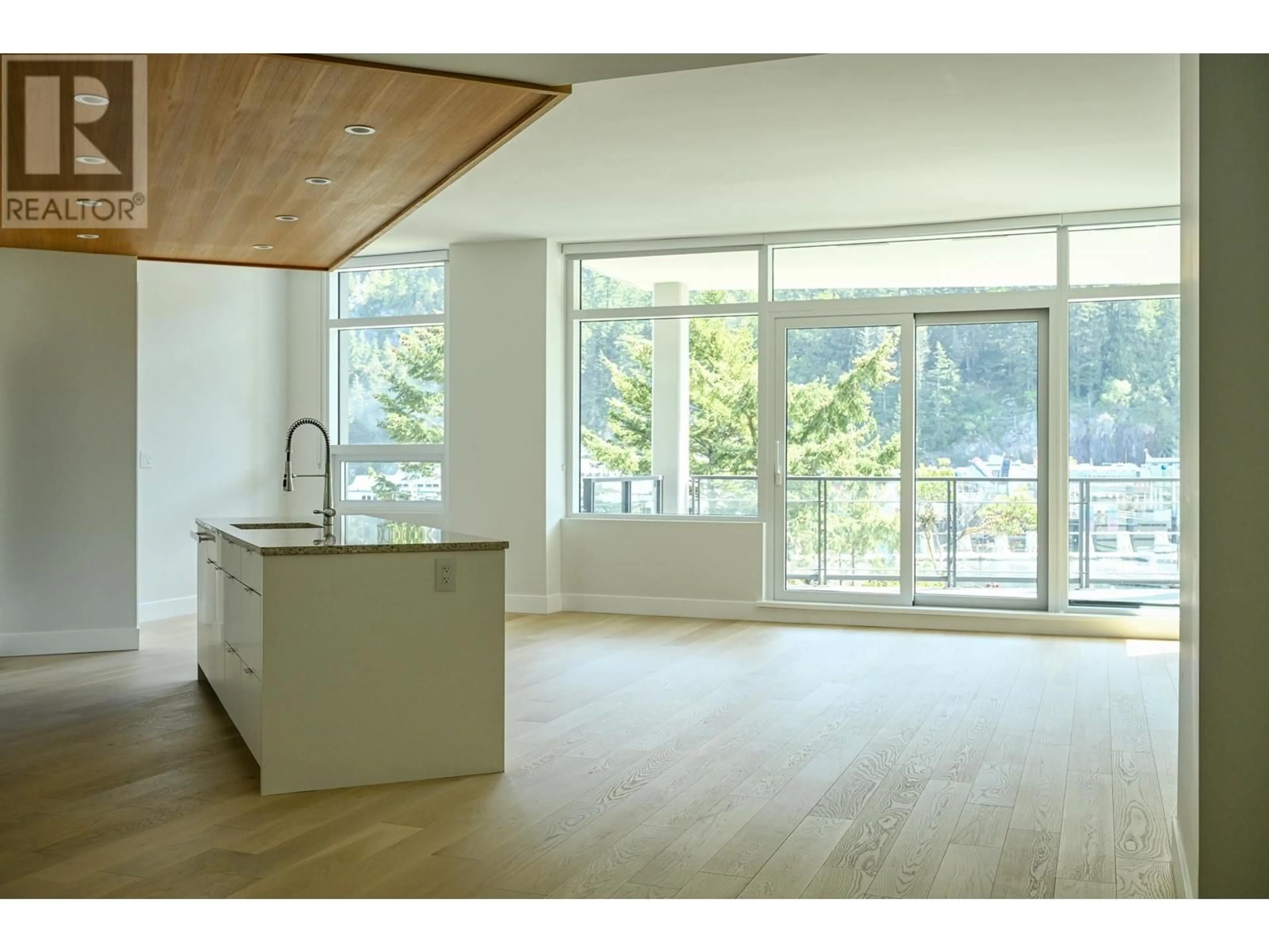 Open concept kitchen, wood/laminate floor for 302 - 6707 NELSON AVENUE, West Vancouver British Columbia V7W0A4