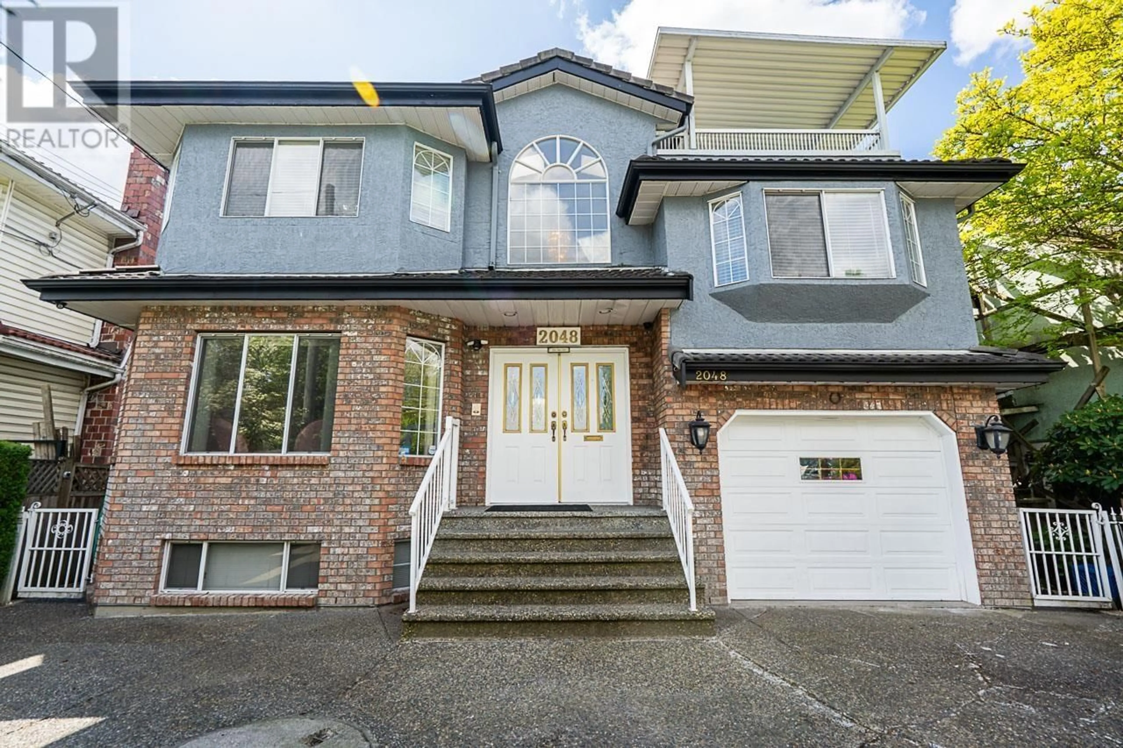 Home with brick exterior material, street for 2048 34TH AVENUE, Vancouver British Columbia V5P1A8
