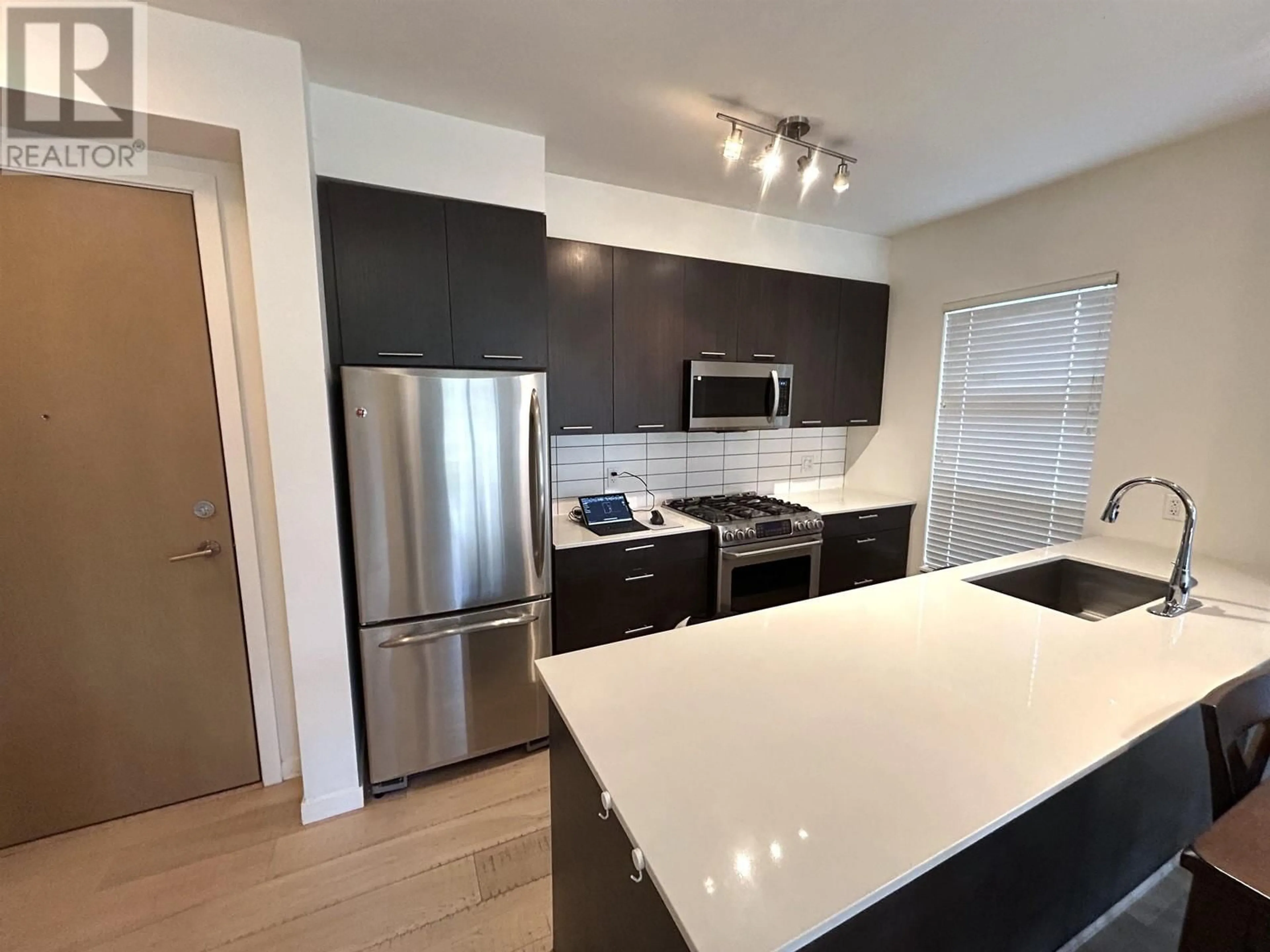 Open concept kitchen, wood/laminate floor for 105 - 245 BROOKES STREET, New Westminster British Columbia V3M0G5