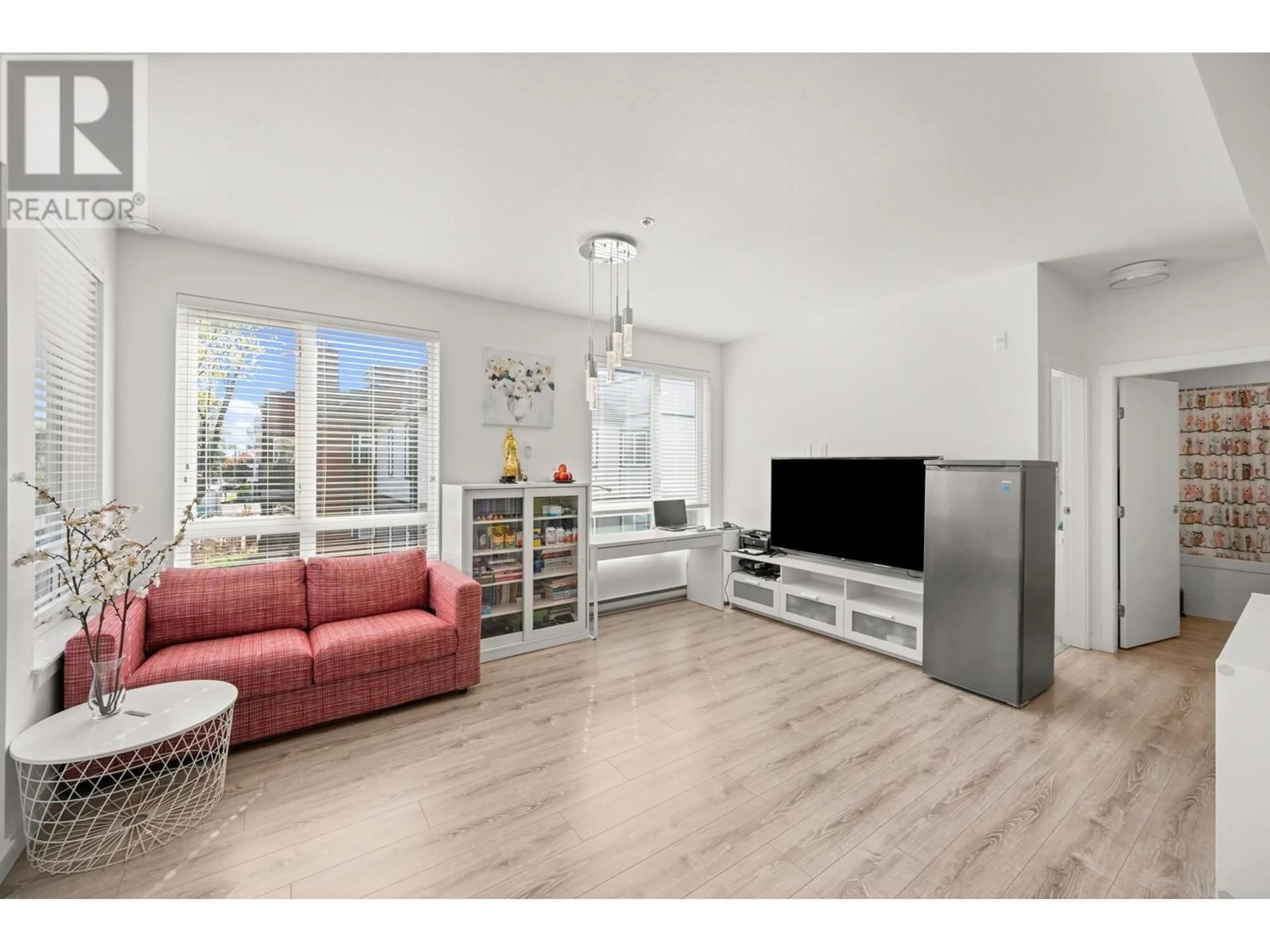 Living room with furniture, wood/laminate floor for 301 - 2382 ATKINS AVENUE, Port Coquitlam British Columbia V3C0G7
